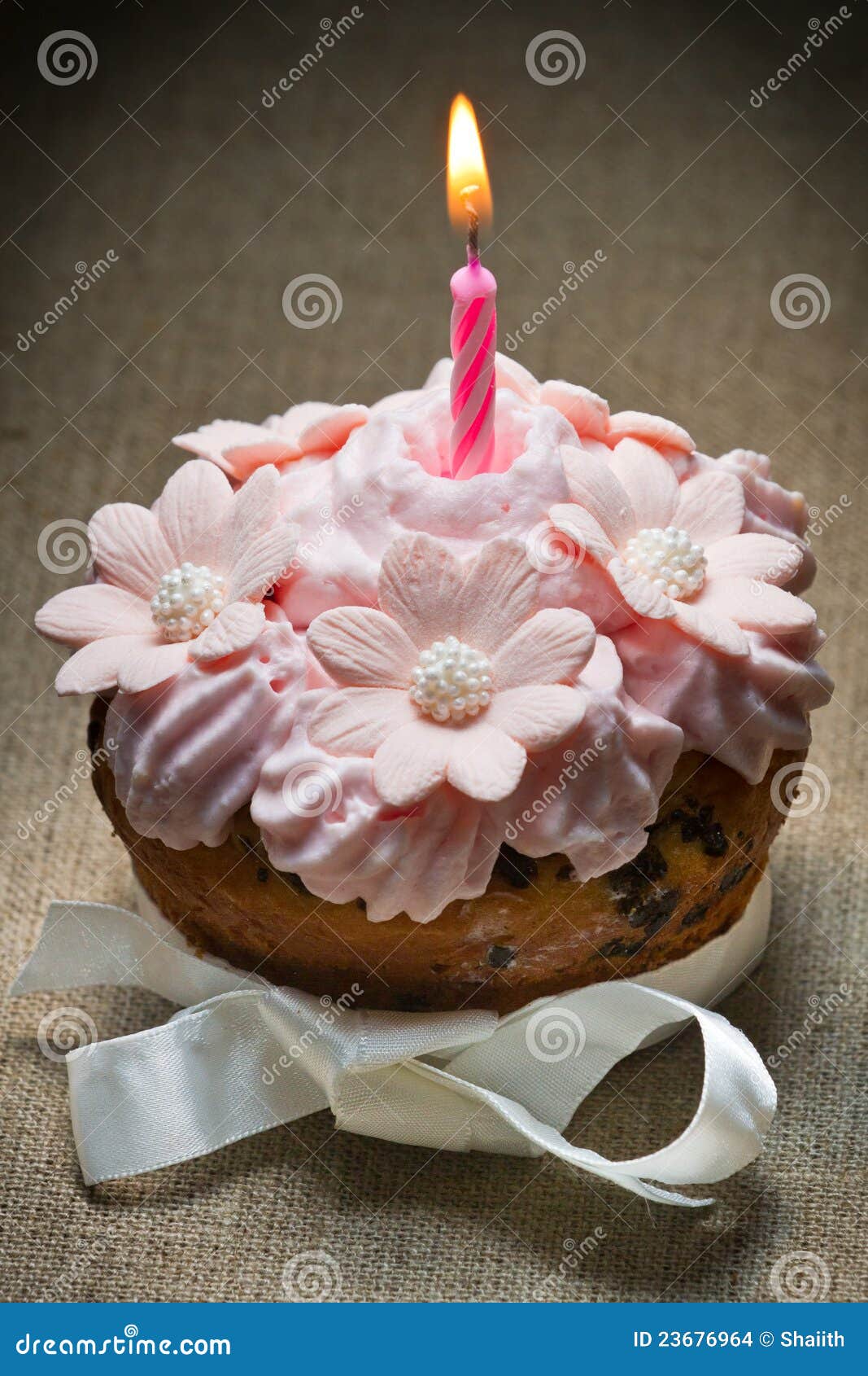 Muffin with burning candle stock photo. Image of object 23676964