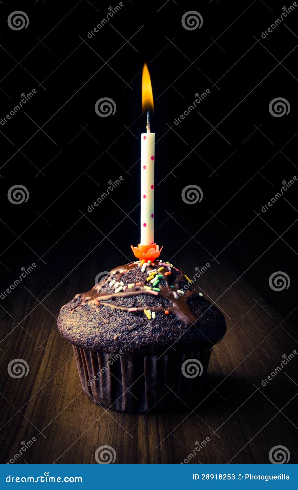 Muffin with burning candle stock image. Image of mini 28918253