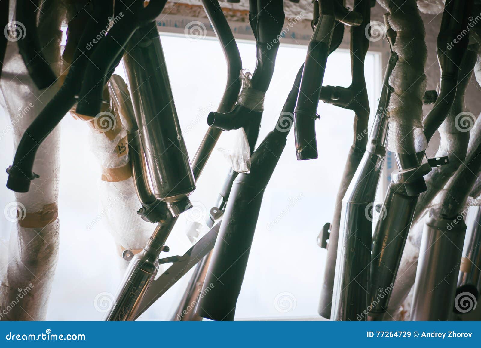 Mufflers Hanging Against Window Stock Image Image of pipe, automobile