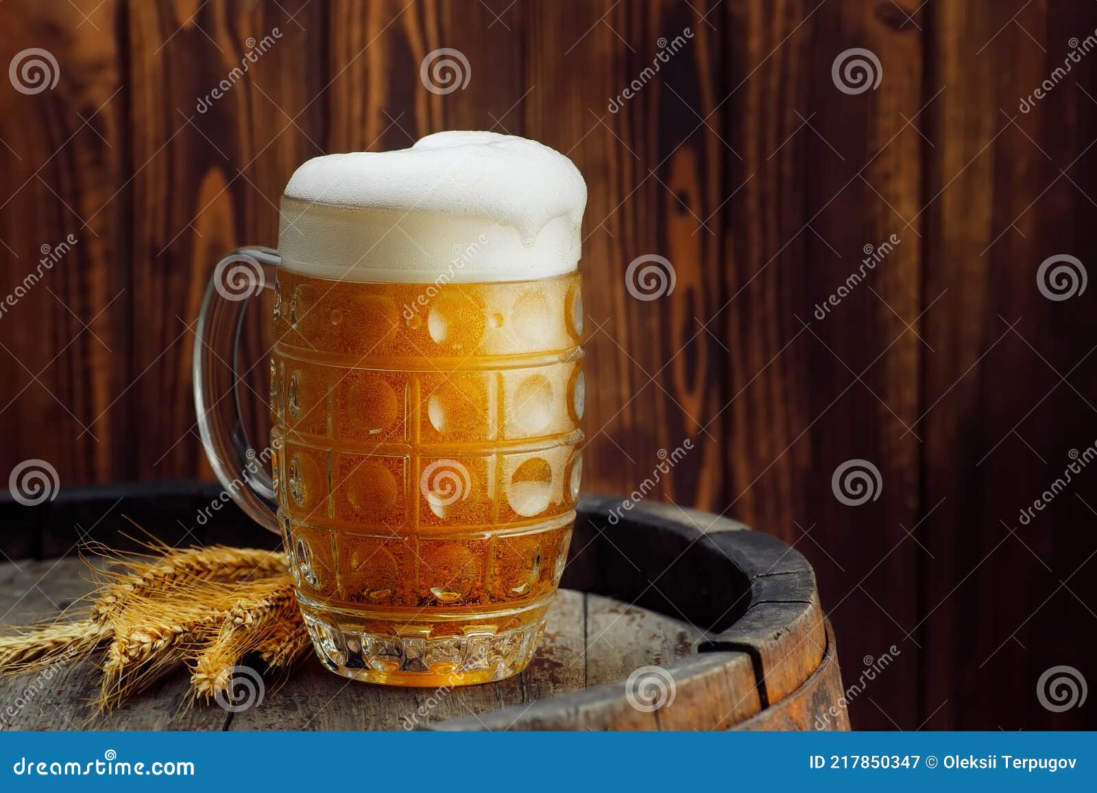 Mug of beer on barrel stock image. Image of foam, glass 217850347