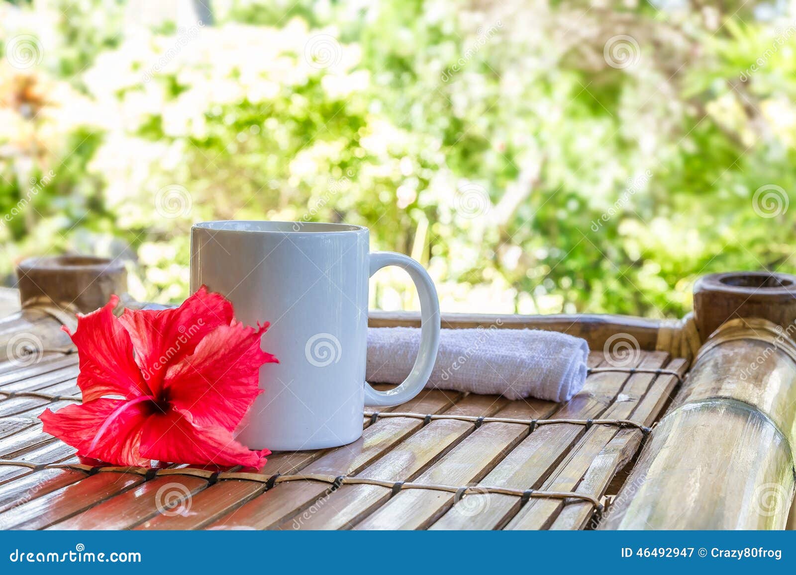 mug with cappuchino on bamboo table, coffee cup in the mor