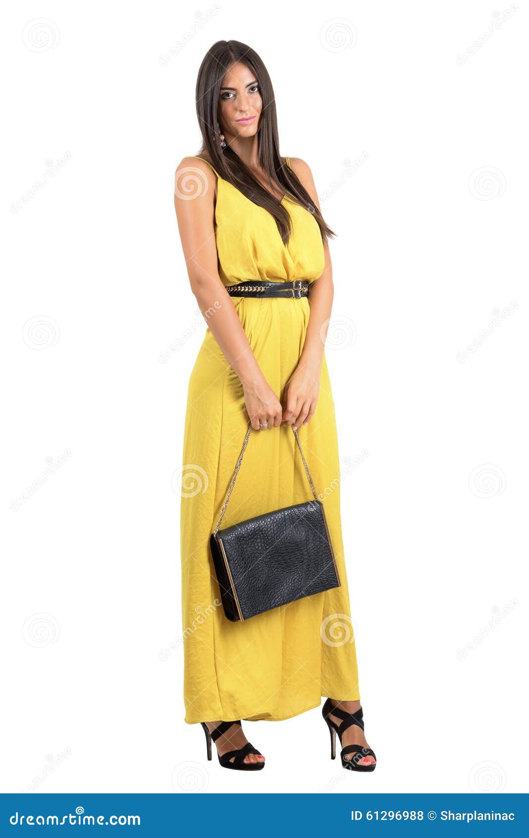 Mujer Atractiva Sensual En El Mono Amarillo Que Sostiene De Cuero Negro Foto de archivo - Imagen de aislado: 61296988