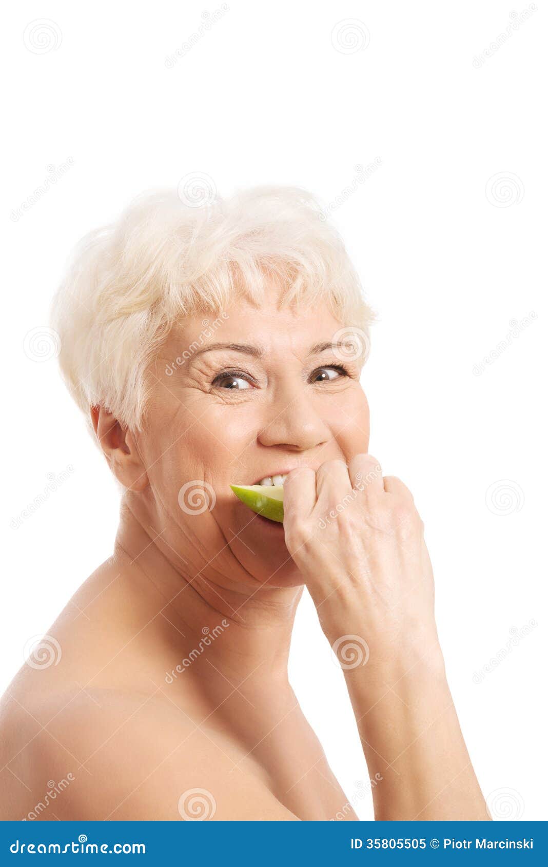 Mujer Mayor Desnuda Que Come Una Manzana imagen