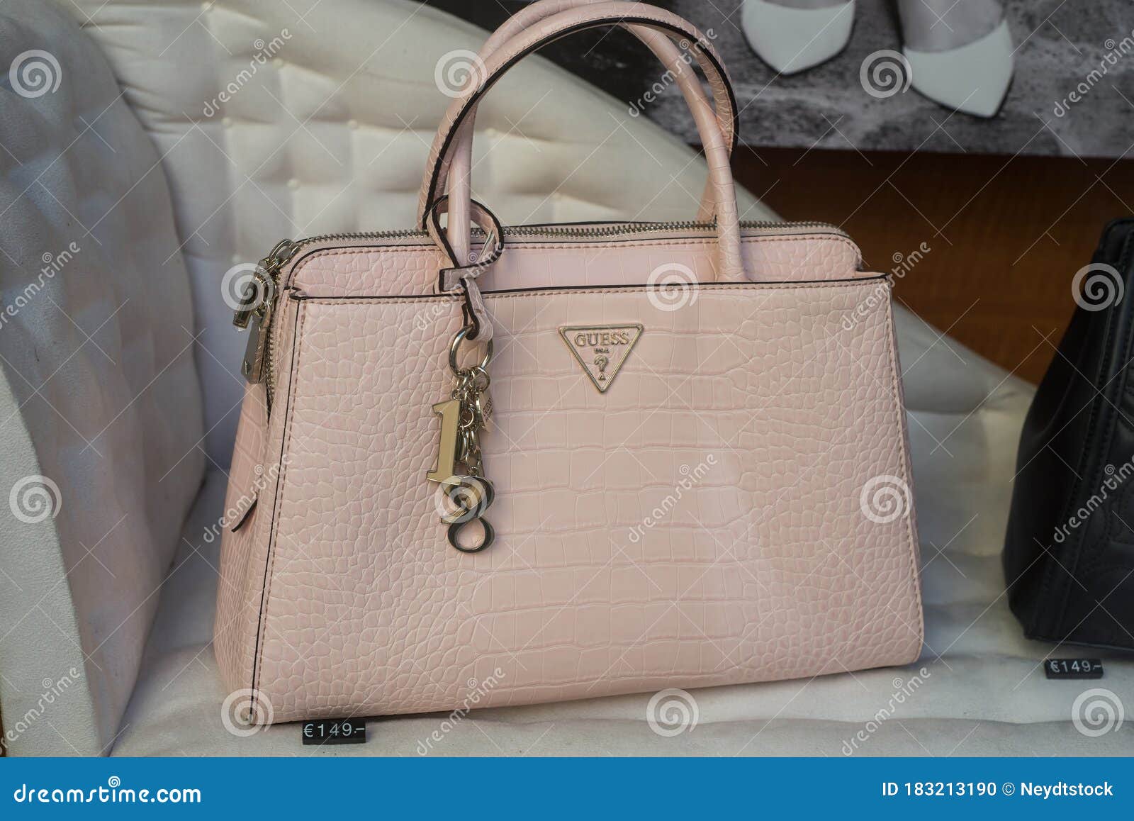 Pink Leather Handbag by GUESS in a Luxury Fashion Store Showroom Editorial Image - of brand, design: 183213190