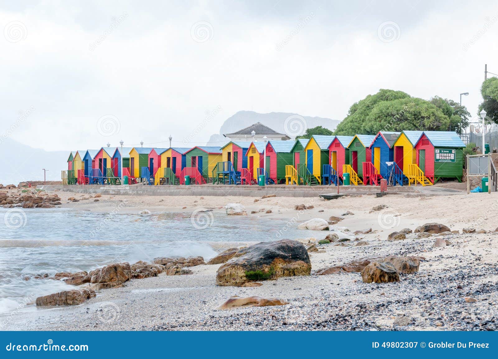 Multicolored Beach Huts at St. James with Railroad Passing by Stock
