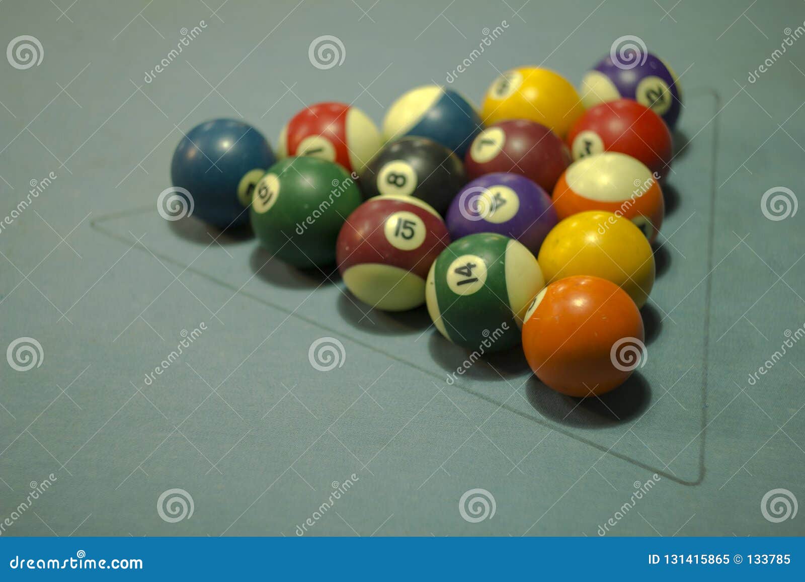 A Multicolored Billiard Balls with Numbers on a Blue Cloth. Balls in a