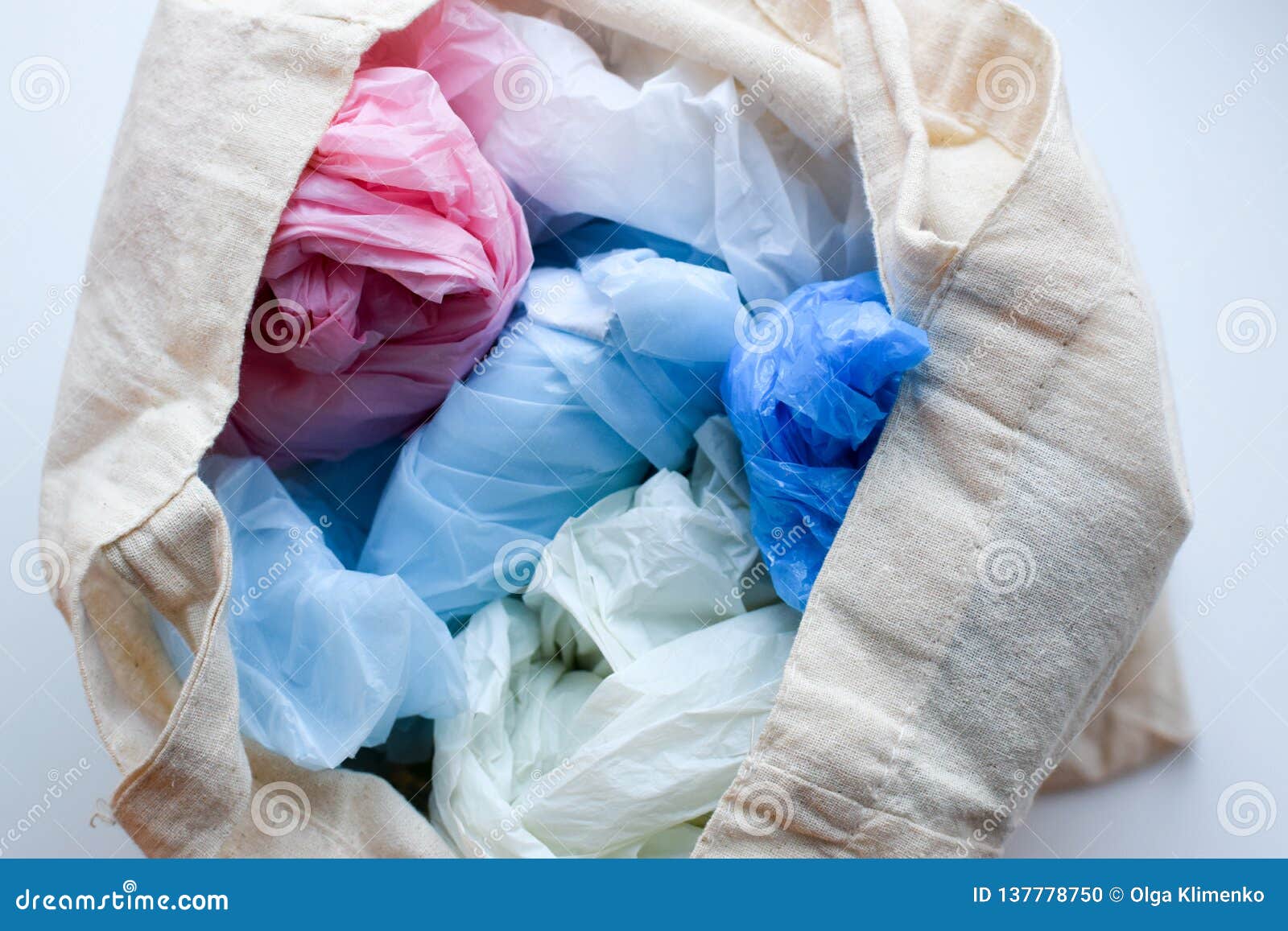 Multicolored Blue, Red, White Plastic Bags in a Rag Cotton Bag Stock