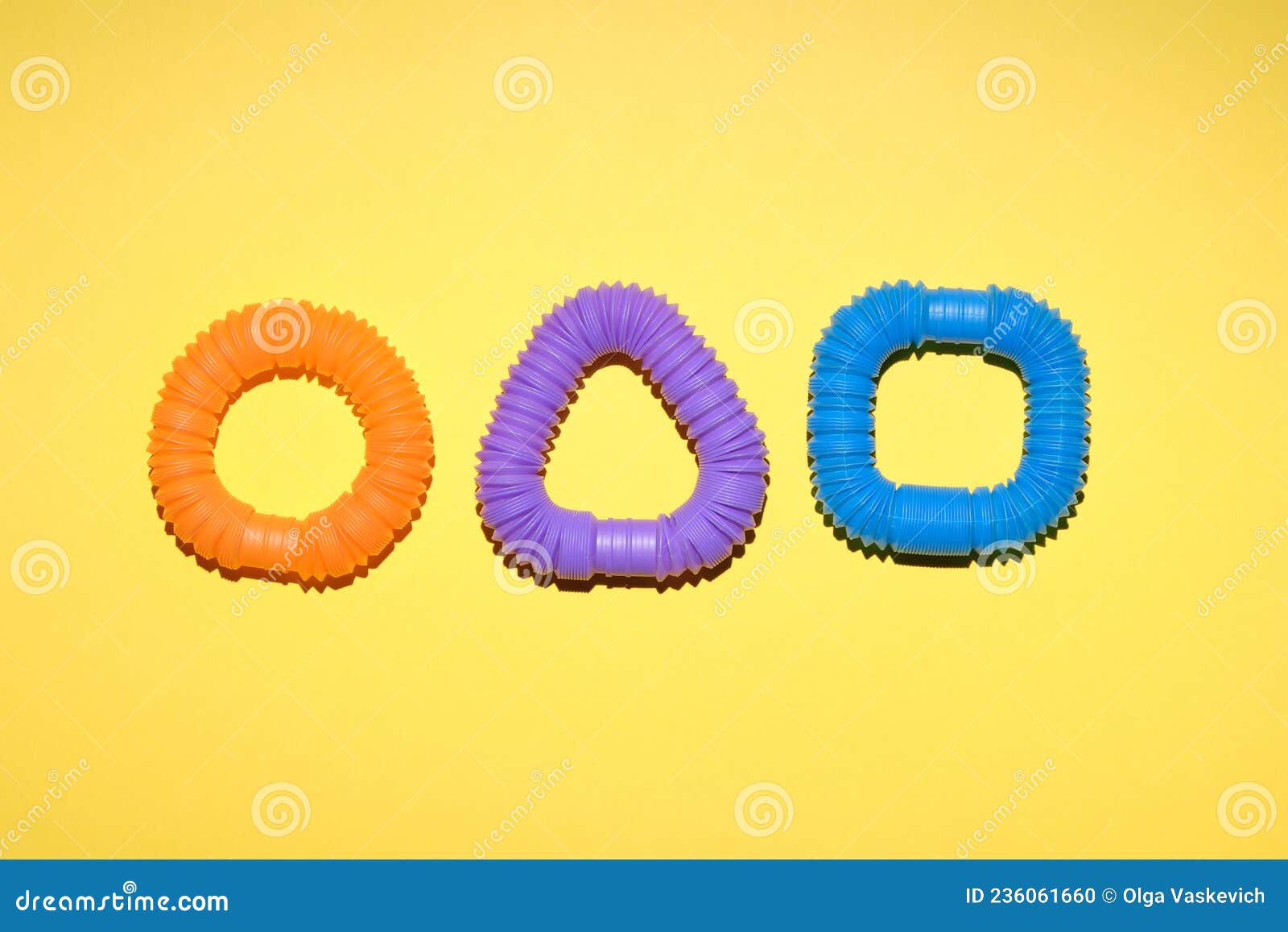 Multicolored Corrugated Plastic Pipes on a Bright Background Stock