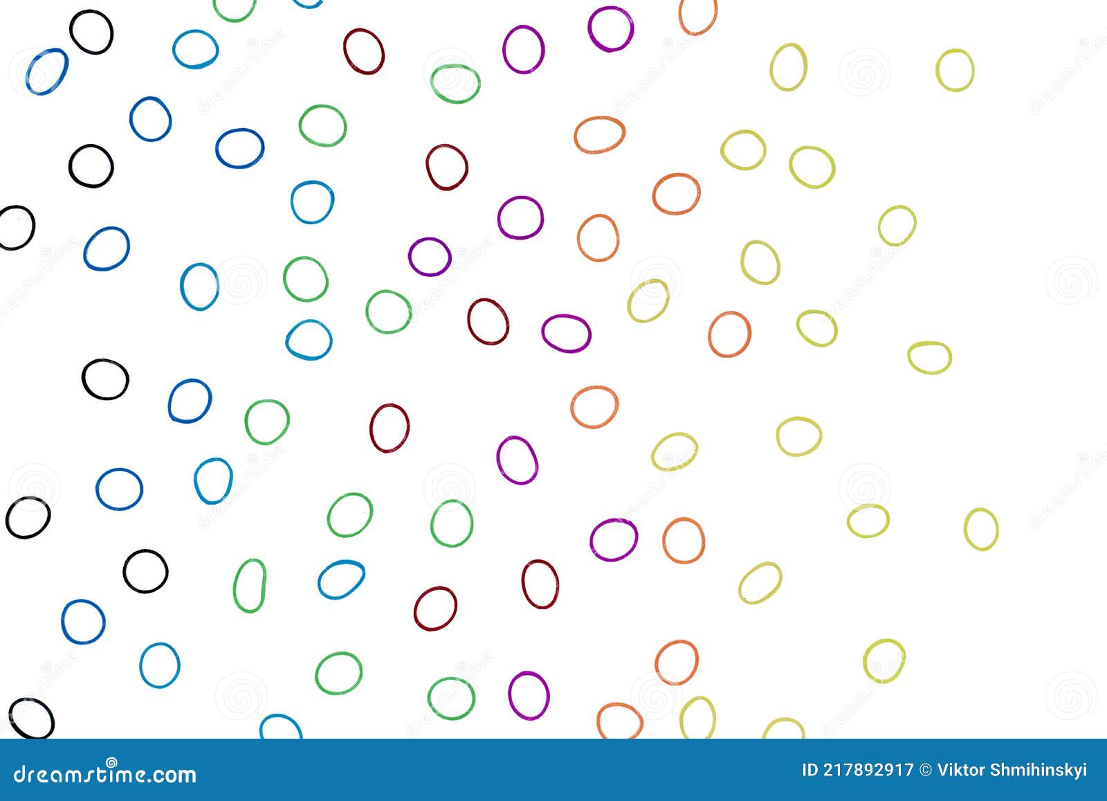 multi-colored elastic bands for weaving a children`s bracelet on a white background close-up.