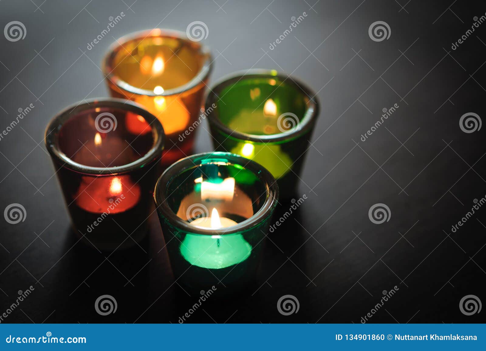 Multicolored Glass Candle Holders. Decorative Glass Candle Jars Stock