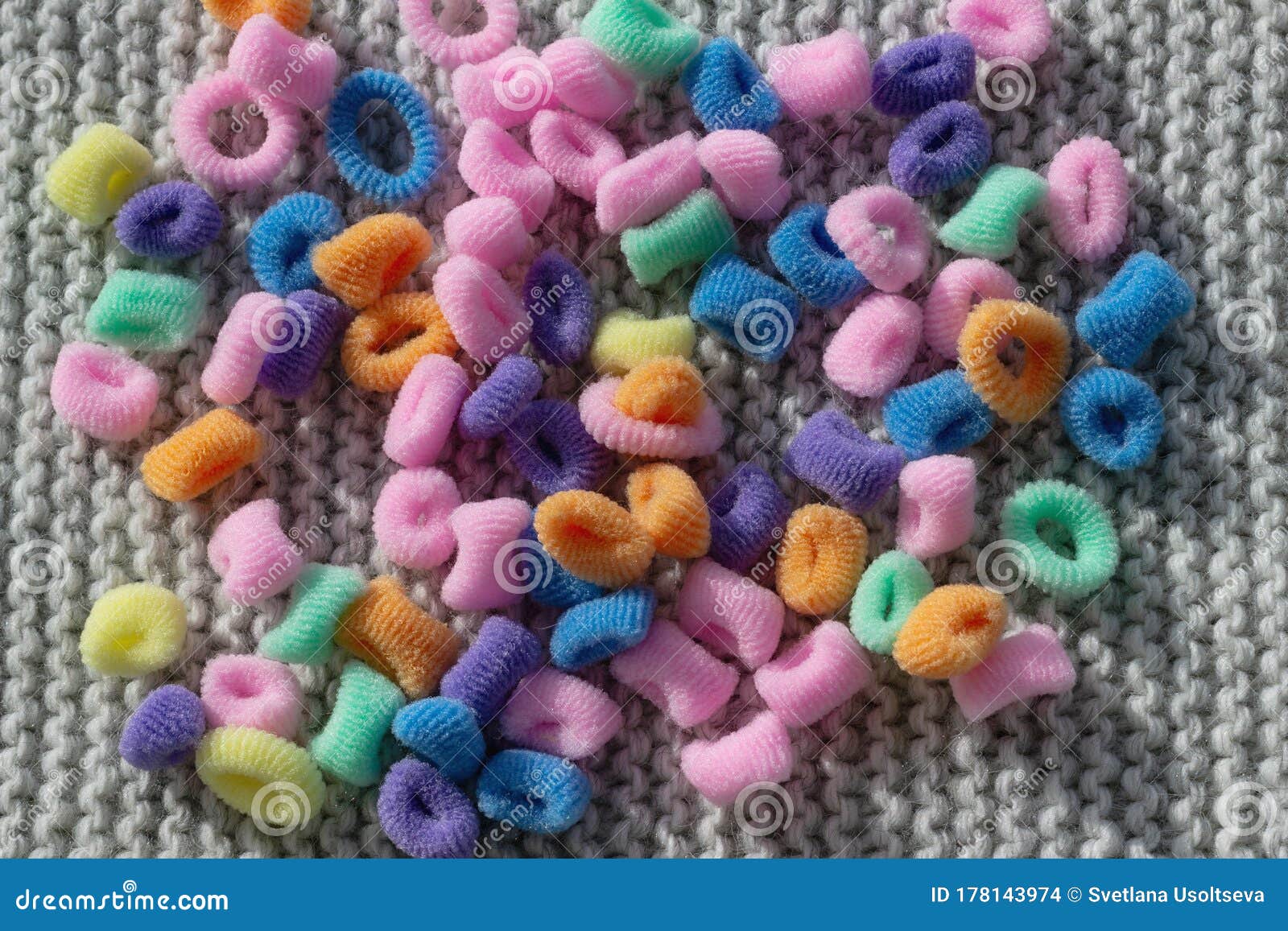 Multi-colored Rubber Bands for Hair on a Gray Knitted Background. Copy  Space, Wallpaper, Hair Accessories, Close-up of Stock Photo - Image of  blue, pink: 178143974