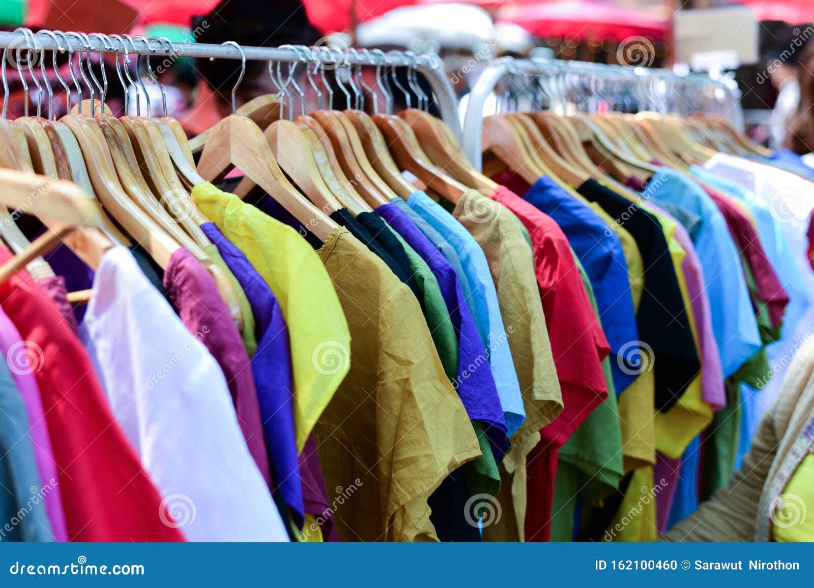 Multi-colored Shirts Hang on Rails Stock Photo - Image of wear, shirt ...