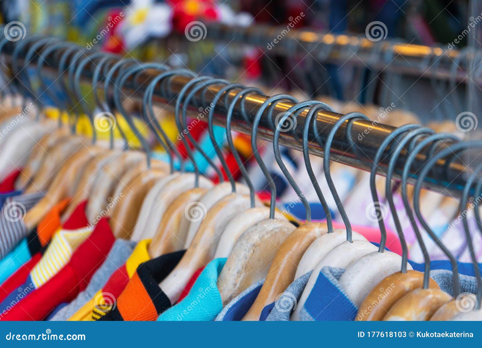 Multi-colored T-shirts on a Hanger. Clothing Store Stock Image - Image ...