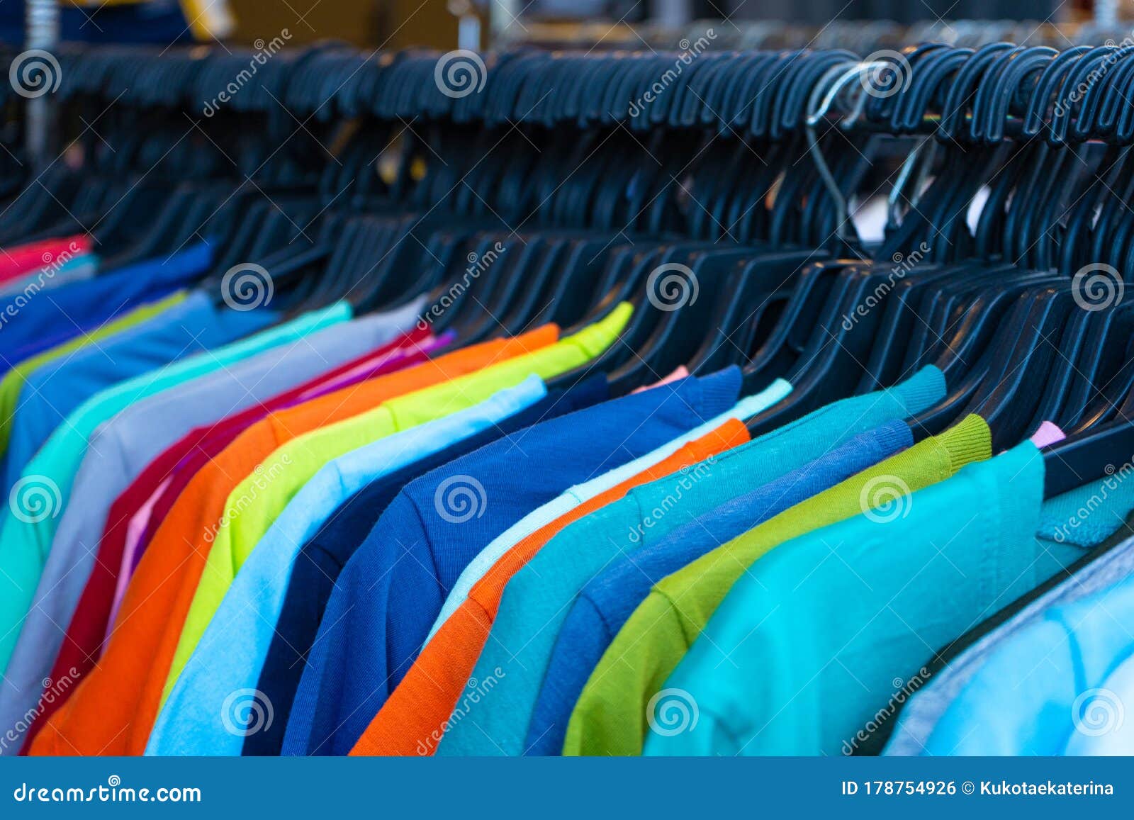 Multi-colored T-shirts on a Hanger. Clothing Store Stock Photo - Image ...