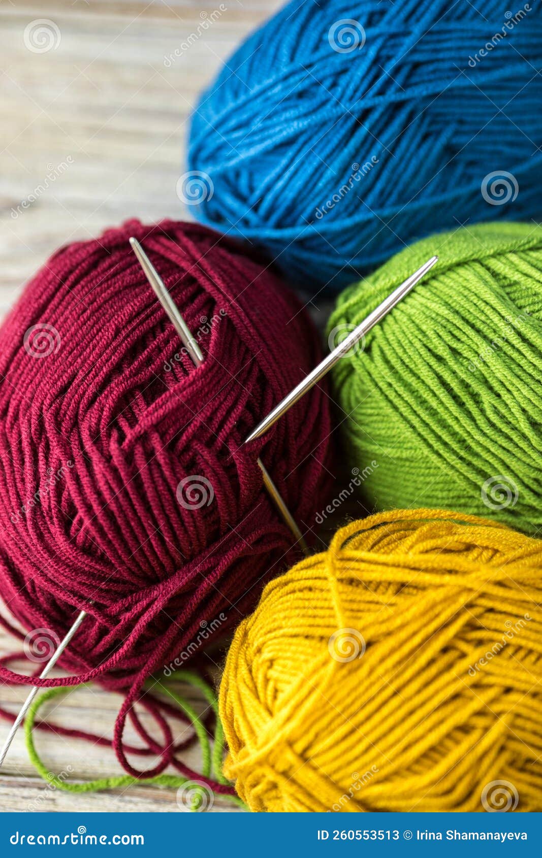 Multicolored Threads for Knitting and Knitting Needles. Selection of