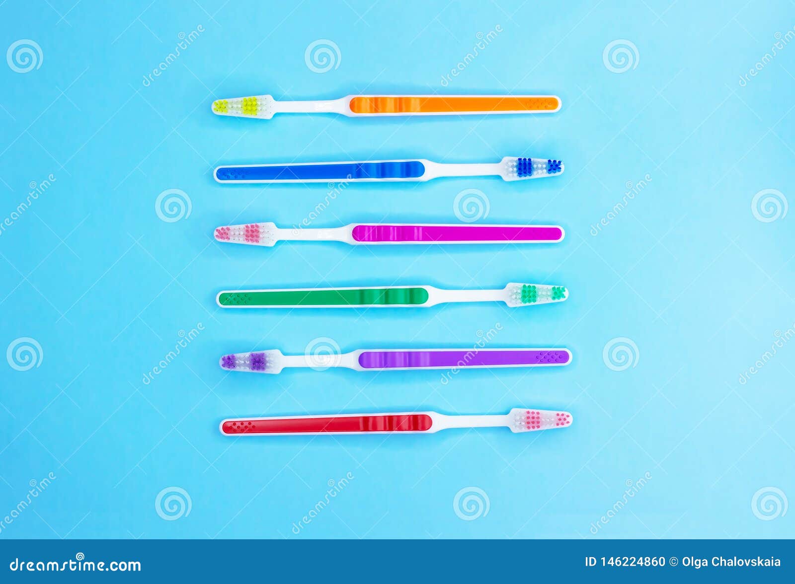 Multicolored Toothbrushes on a Blue Background Stock Photo Image of