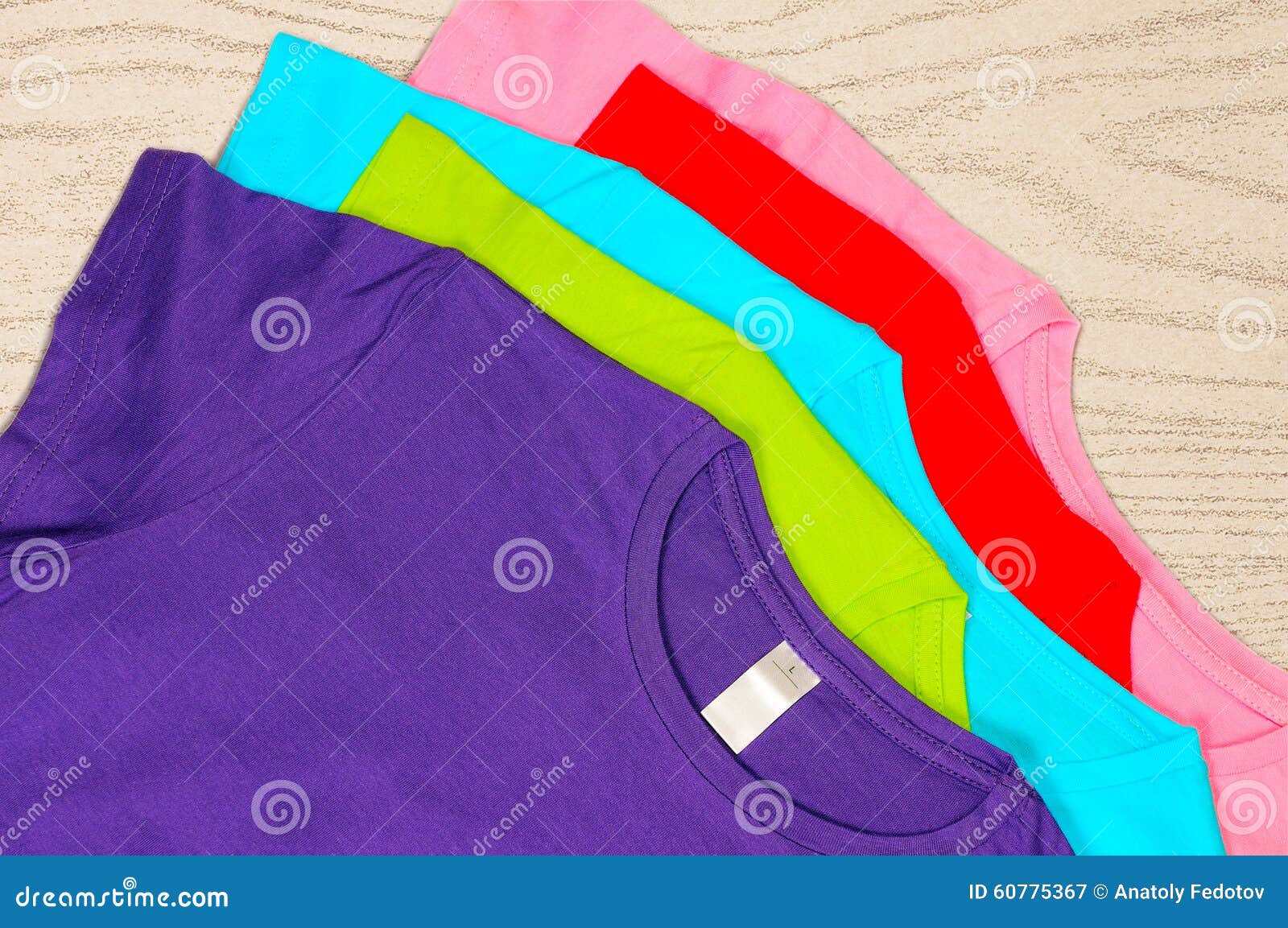 Multi-colored Women S T-shirts Lie on Wooden Background. Stock Image ...