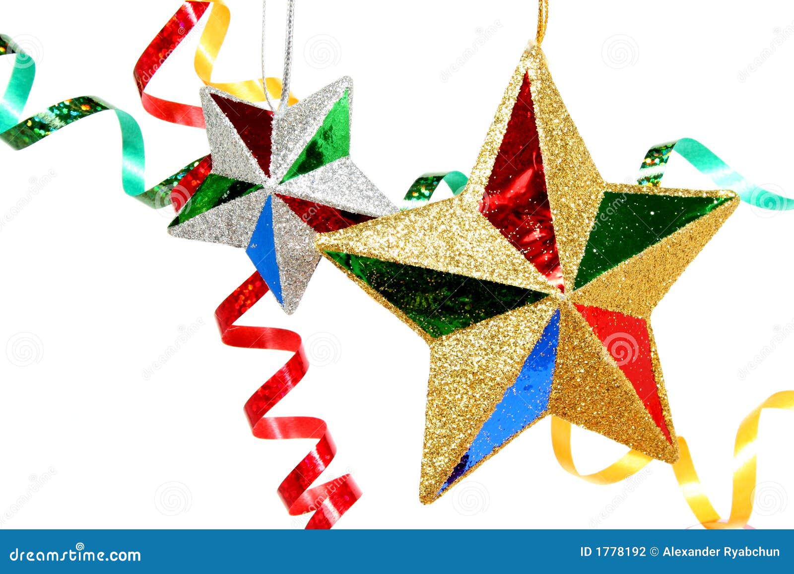 Multicoloured Celebratory Tinsel and Two Christmas Stars Stock Photo