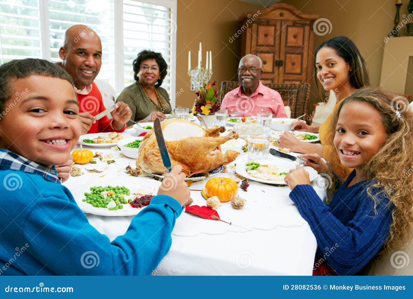 multi generation family celebrating thanksgiving