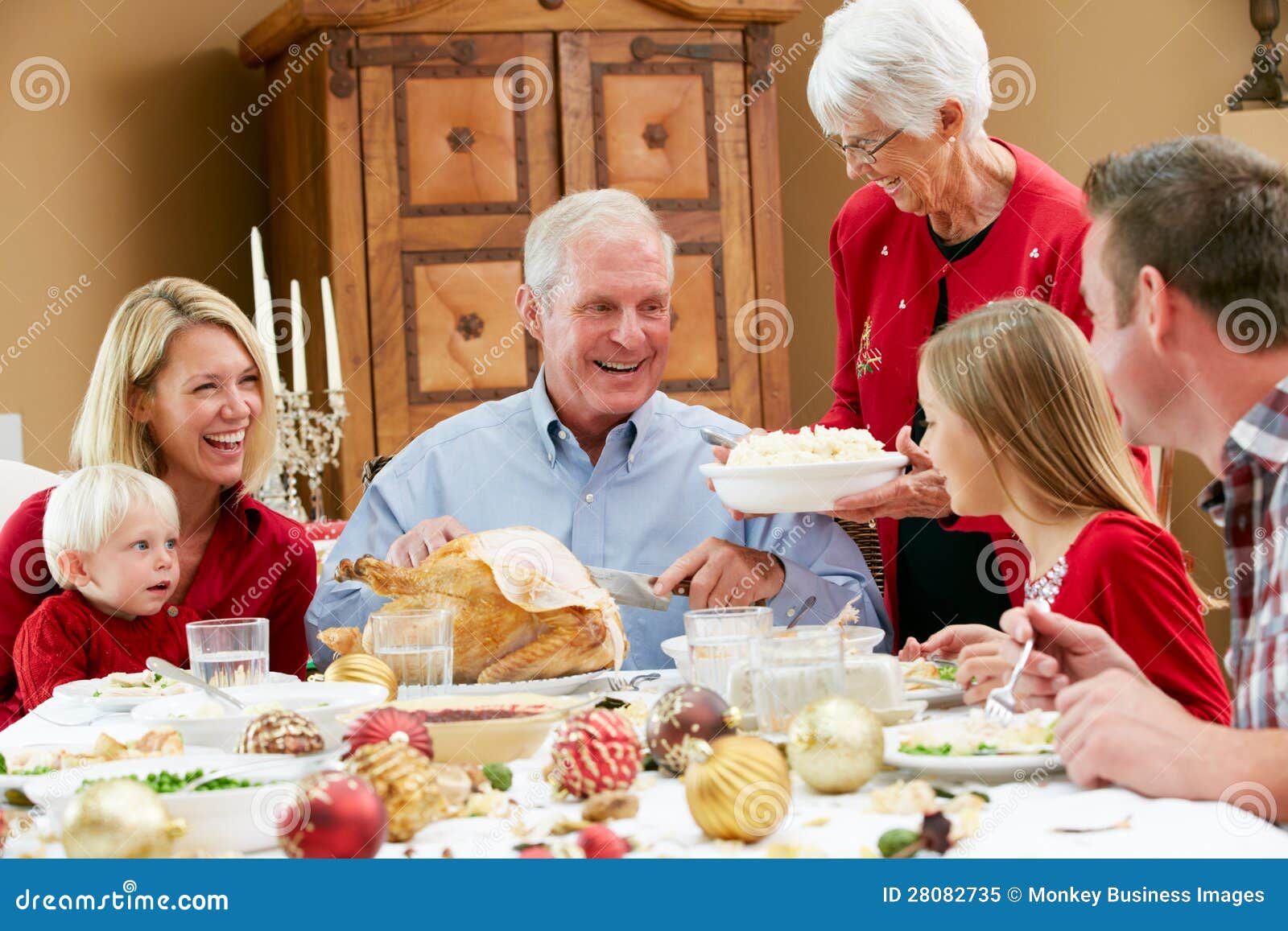 multi generation family having christmas meal