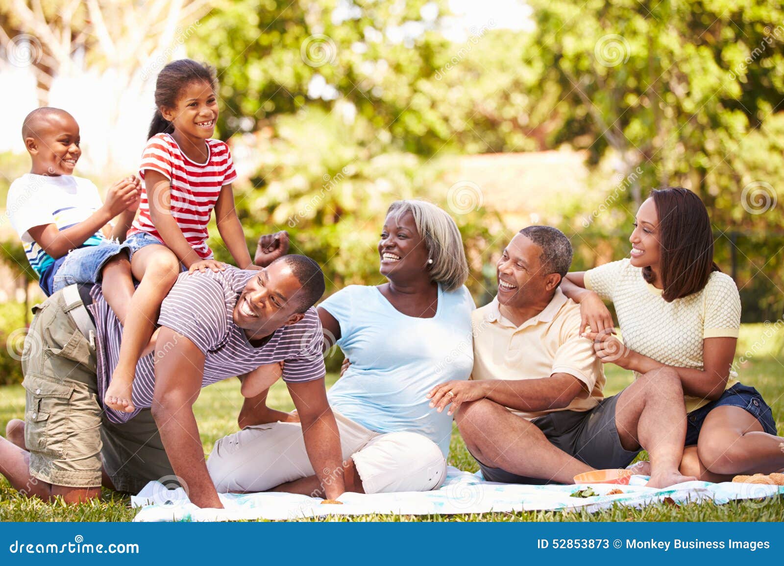 multi generation family having fun in garden together