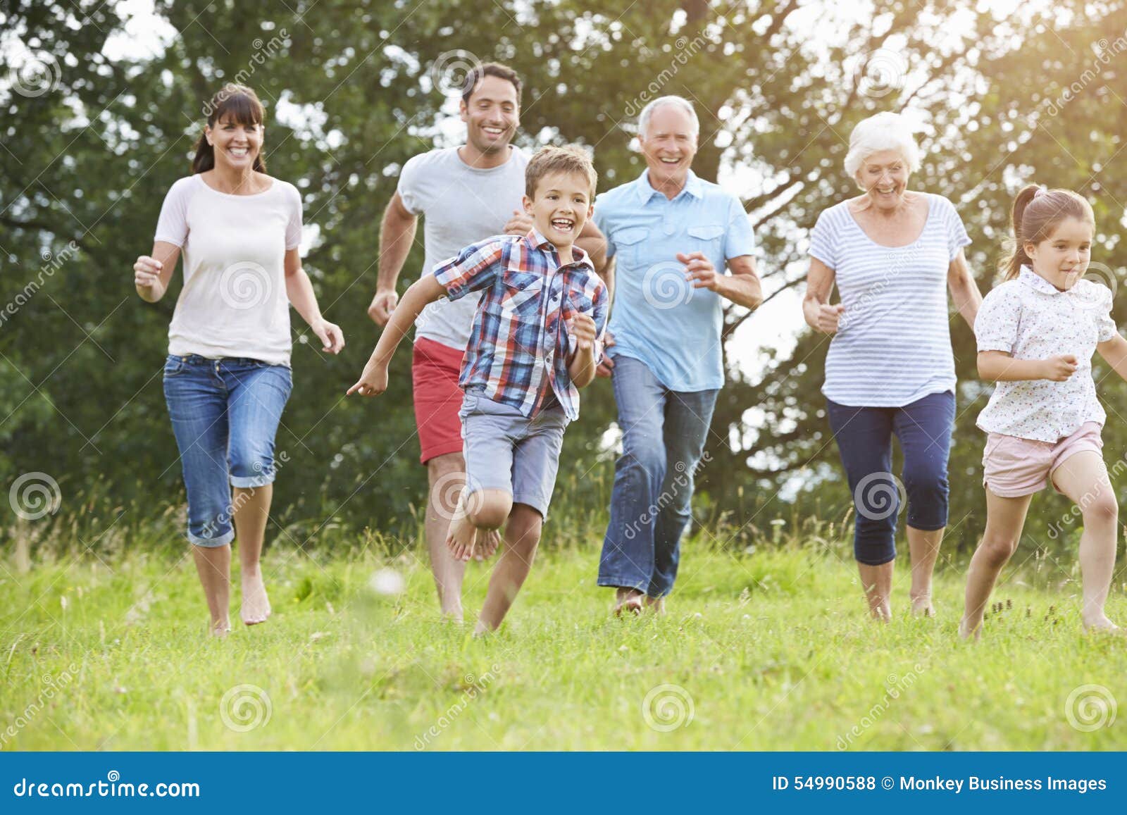 multi generation family running across field together