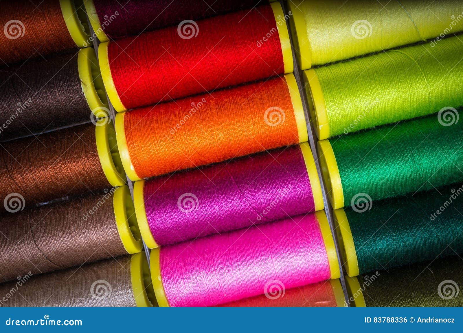 Multicolor sewing threads stock photo. Image of embroidery 83788336