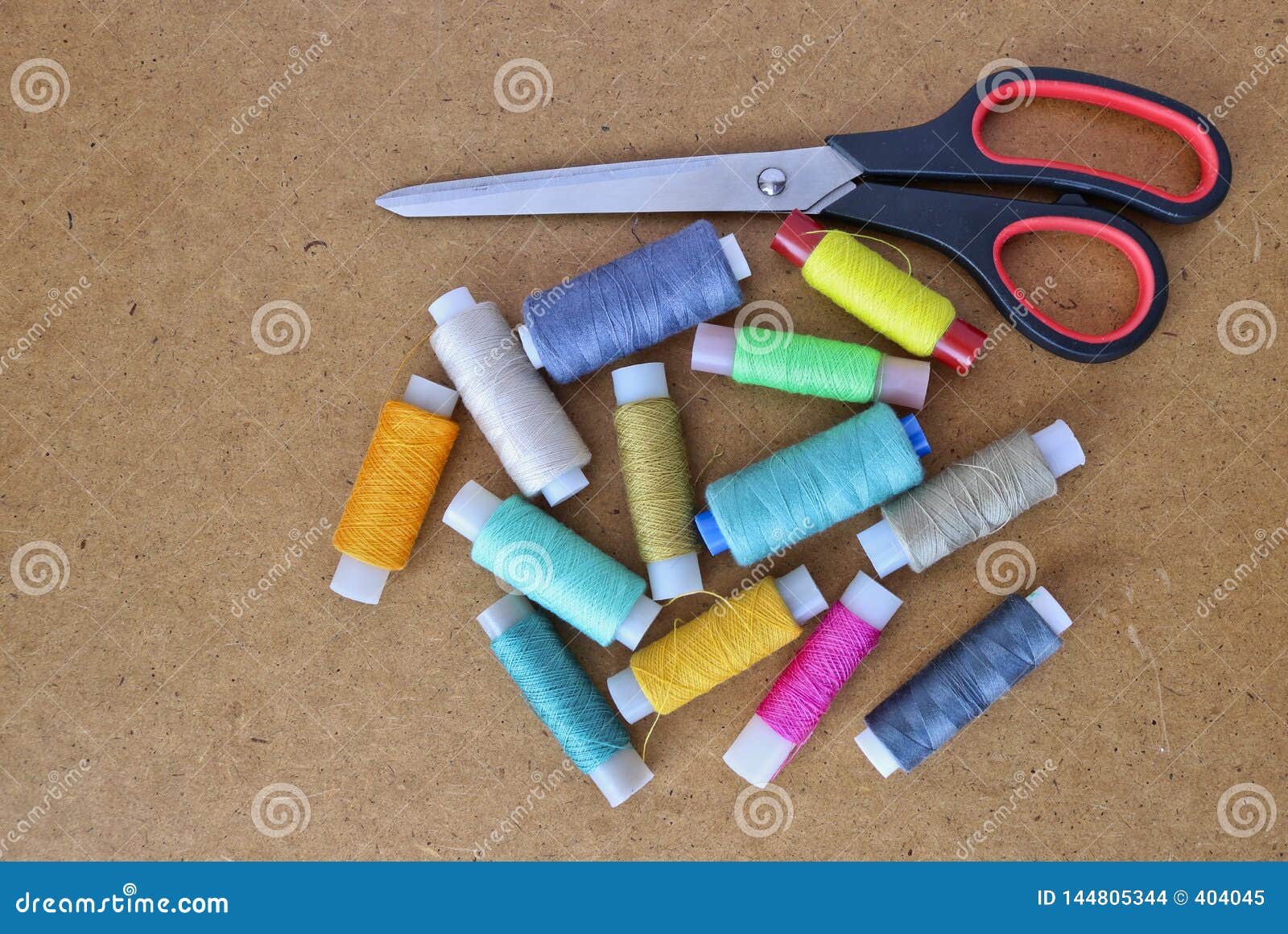 Multicolor Sewing Threads On A Roll For Sewing And Tailoring Scissors