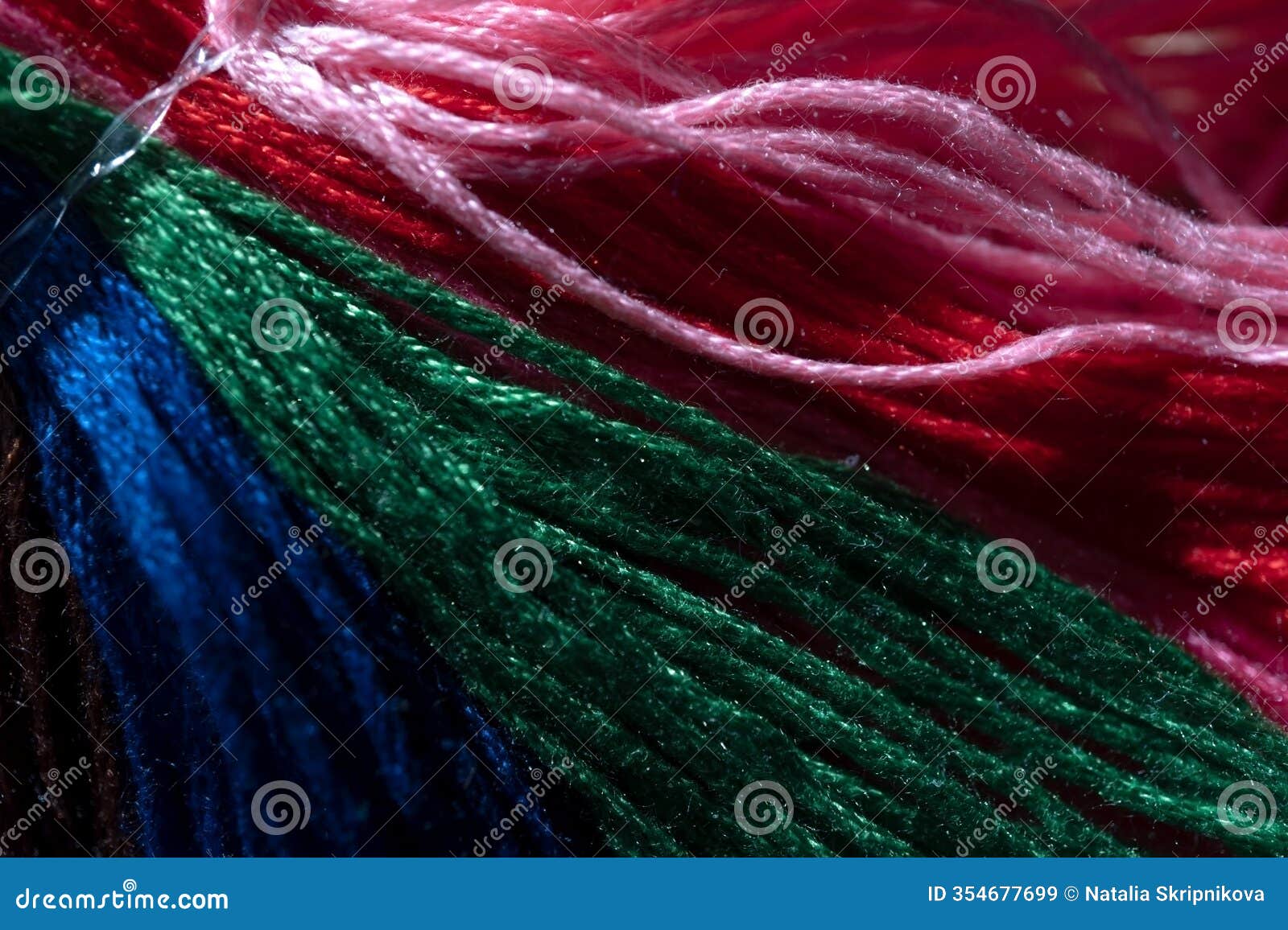 multicolor threads for embroidery , muline. color background.