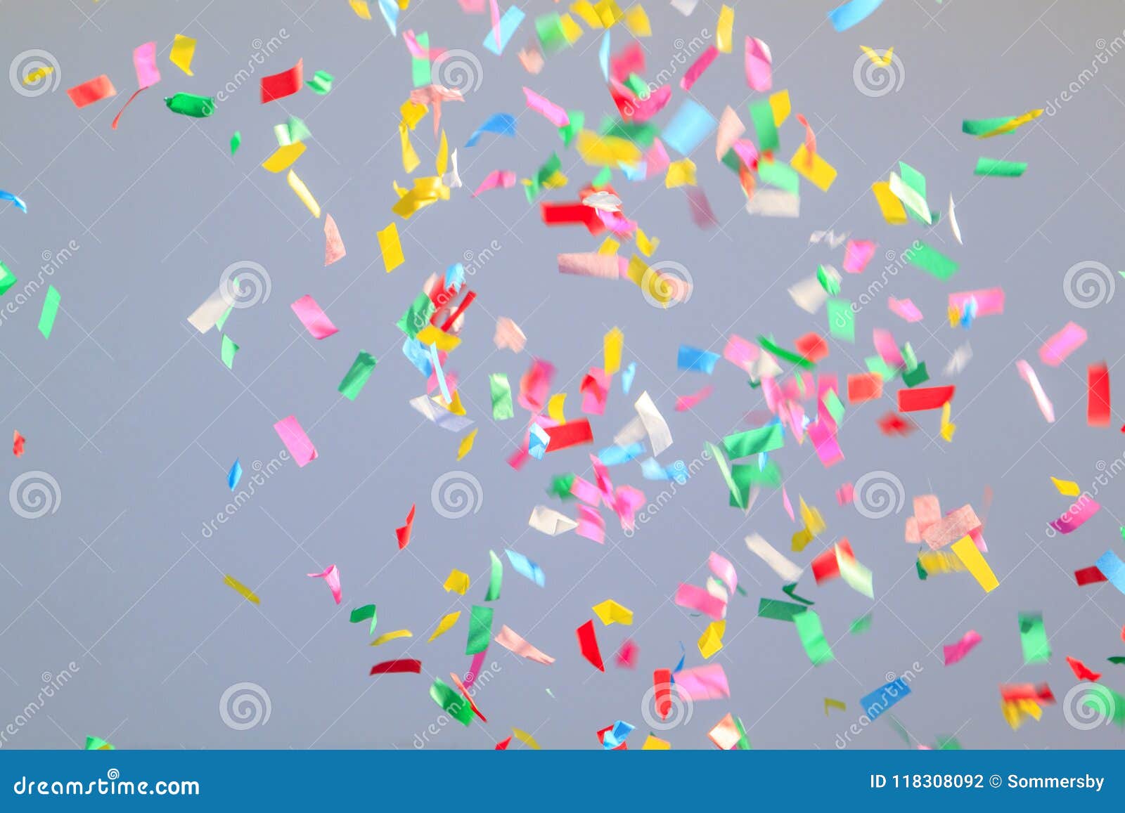 Multicolored Confetti on a Grey Background. Concept of Holiday B Stock