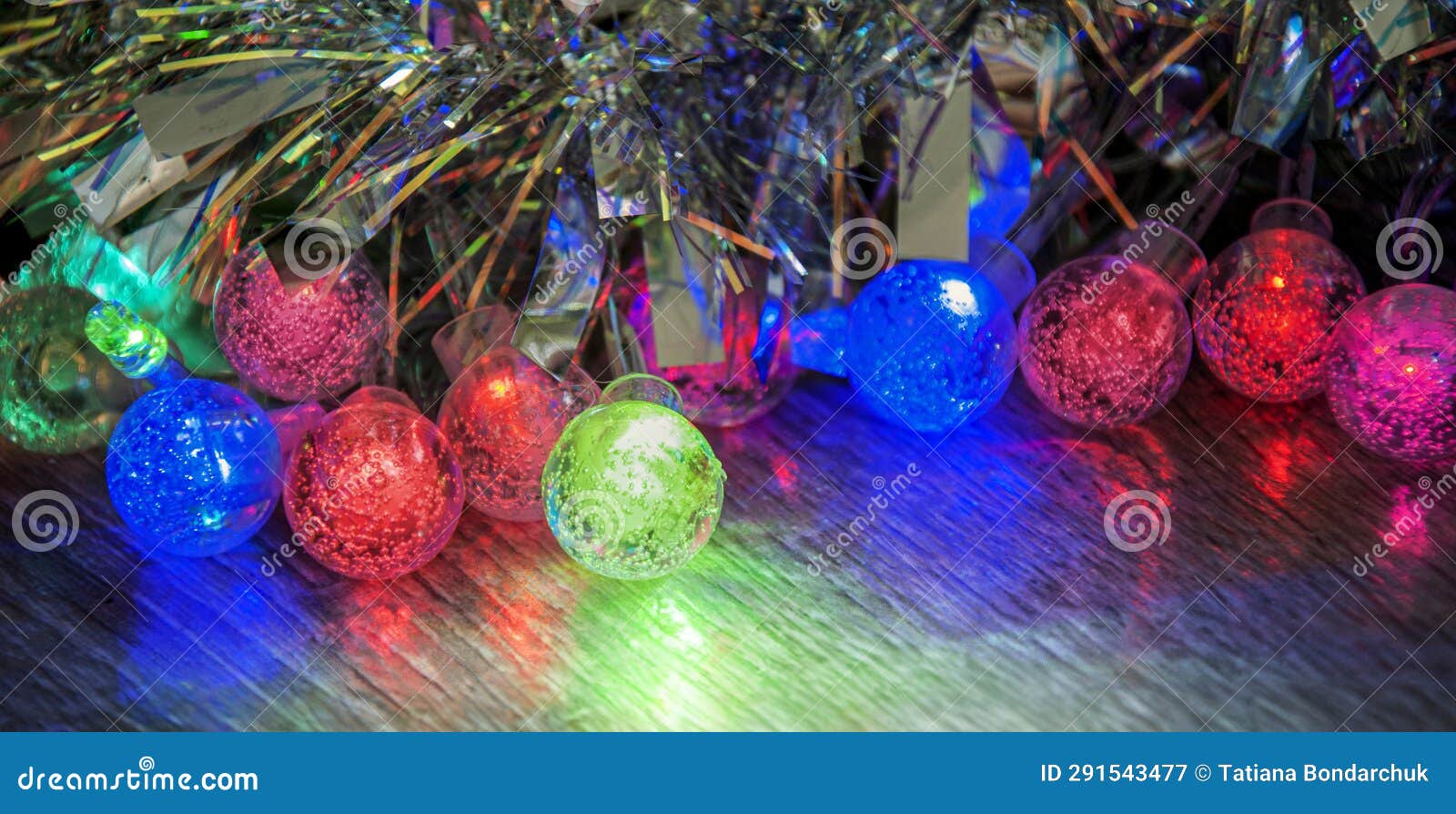 Multicolored Glowing Christmas Balls Garlands Closeup Stock Image