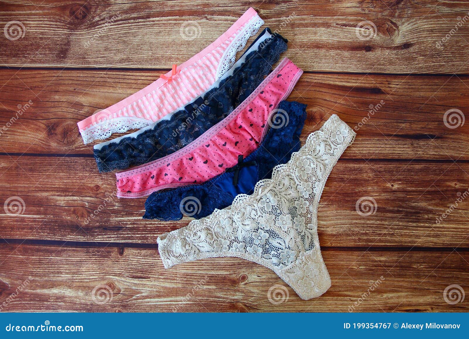 Lingerie. Women`s Lacy Underwear with a Bust and Panties on Wooden