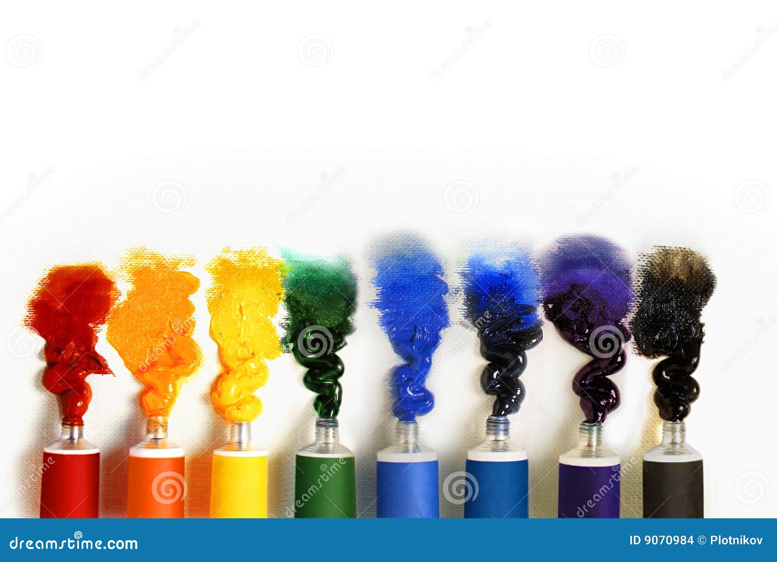 multicolored paint tubes on a white background