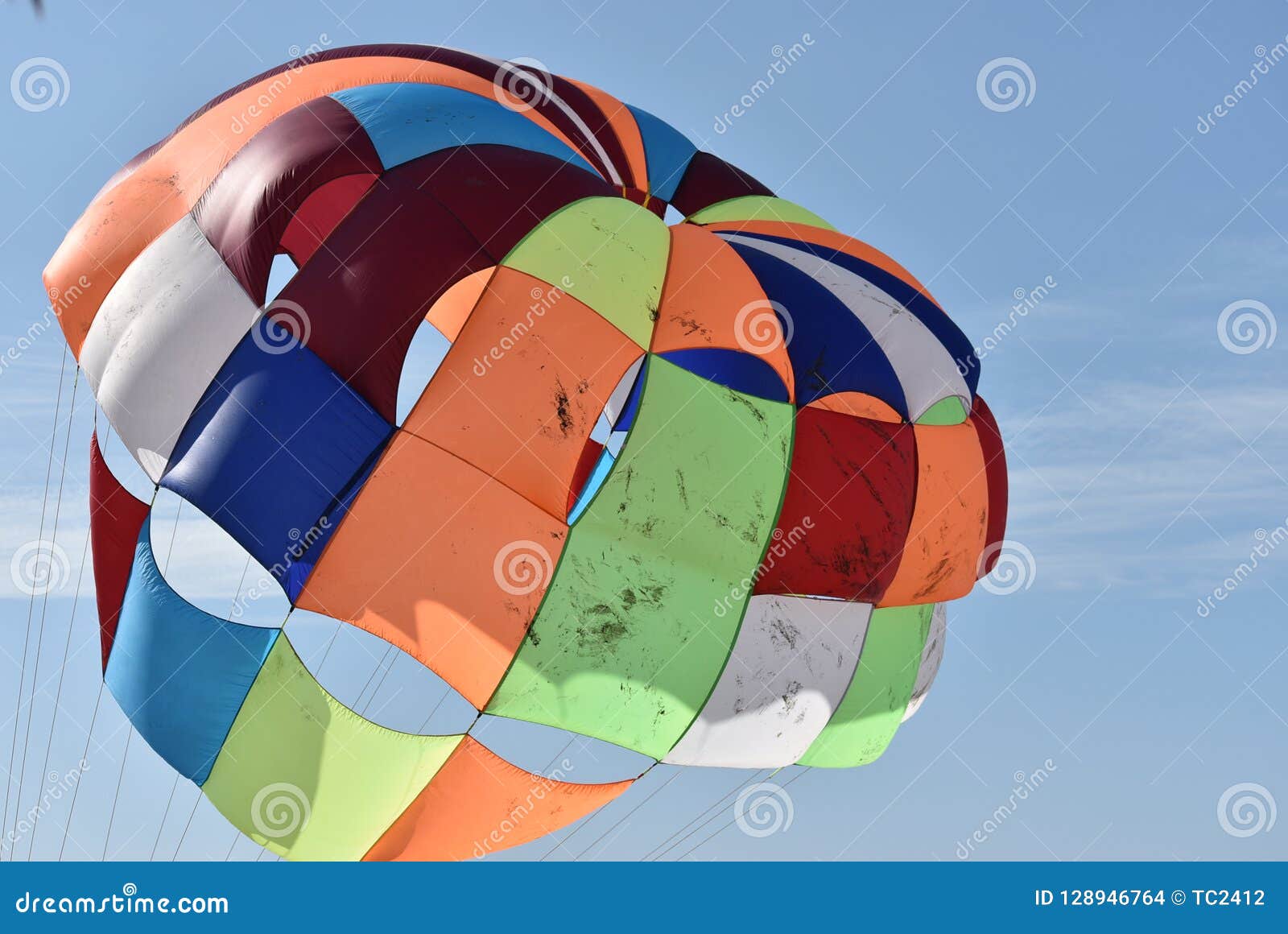 multicolored parasail in flight