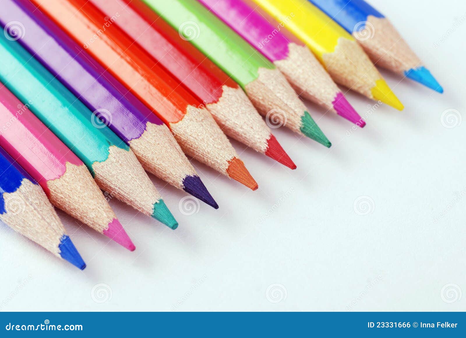 Multicolored pencils. Multicolored crayons in a row on white background. selective focus