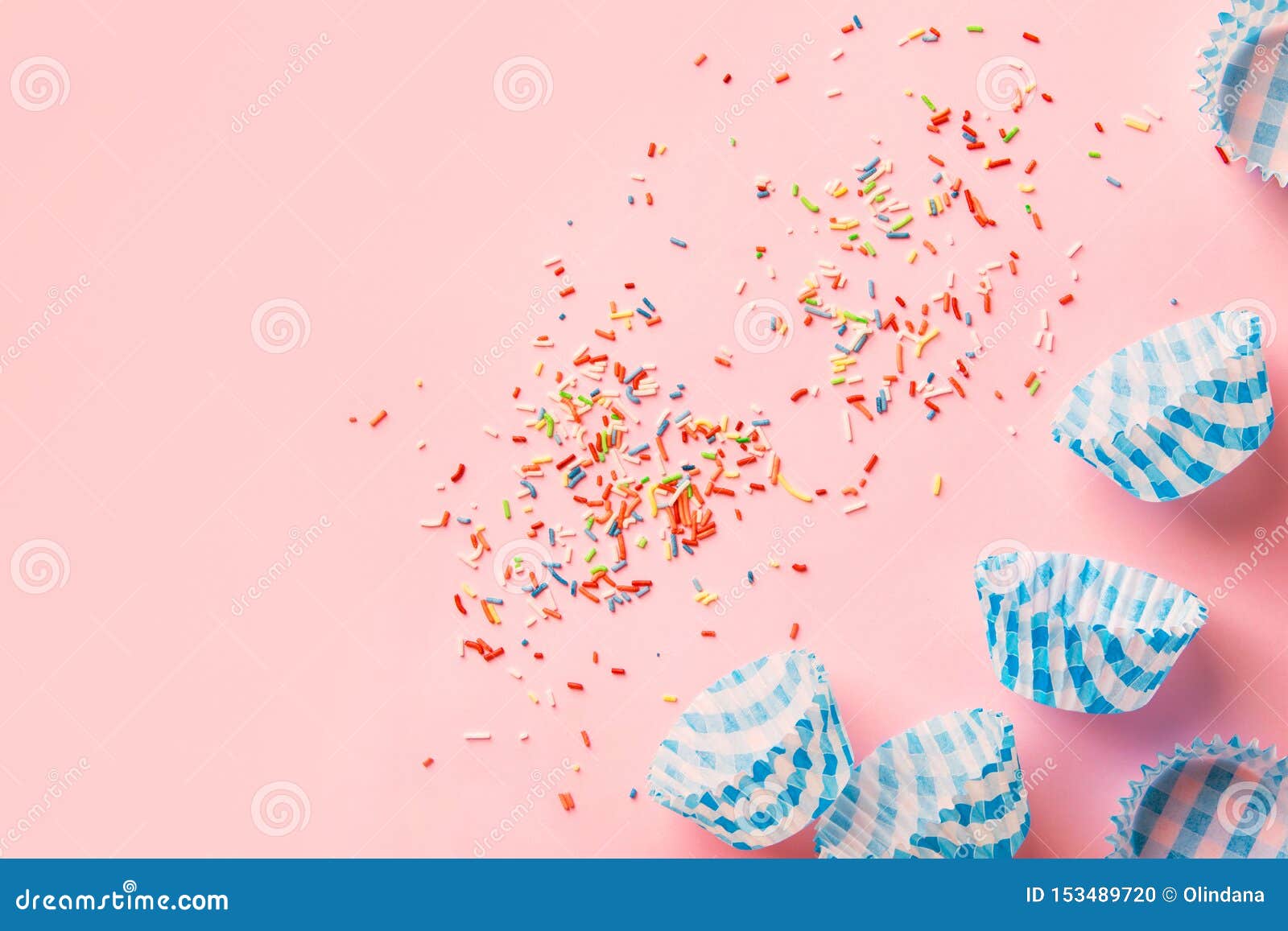 Multicolored Rainbow Sugar Sprinkles Cupcake Blue Paper Cups On Pastel