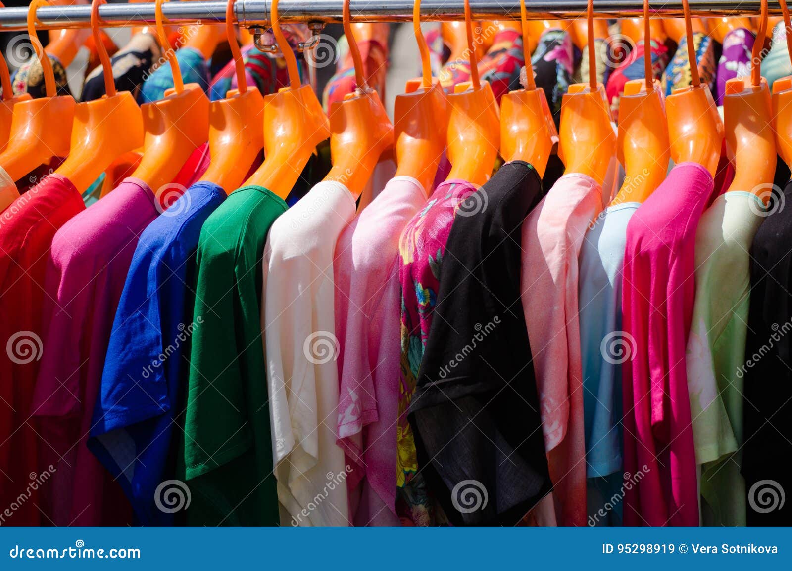 Multicolored T-shirts on Hangers for Sale at a Street Fair Stock Image ...