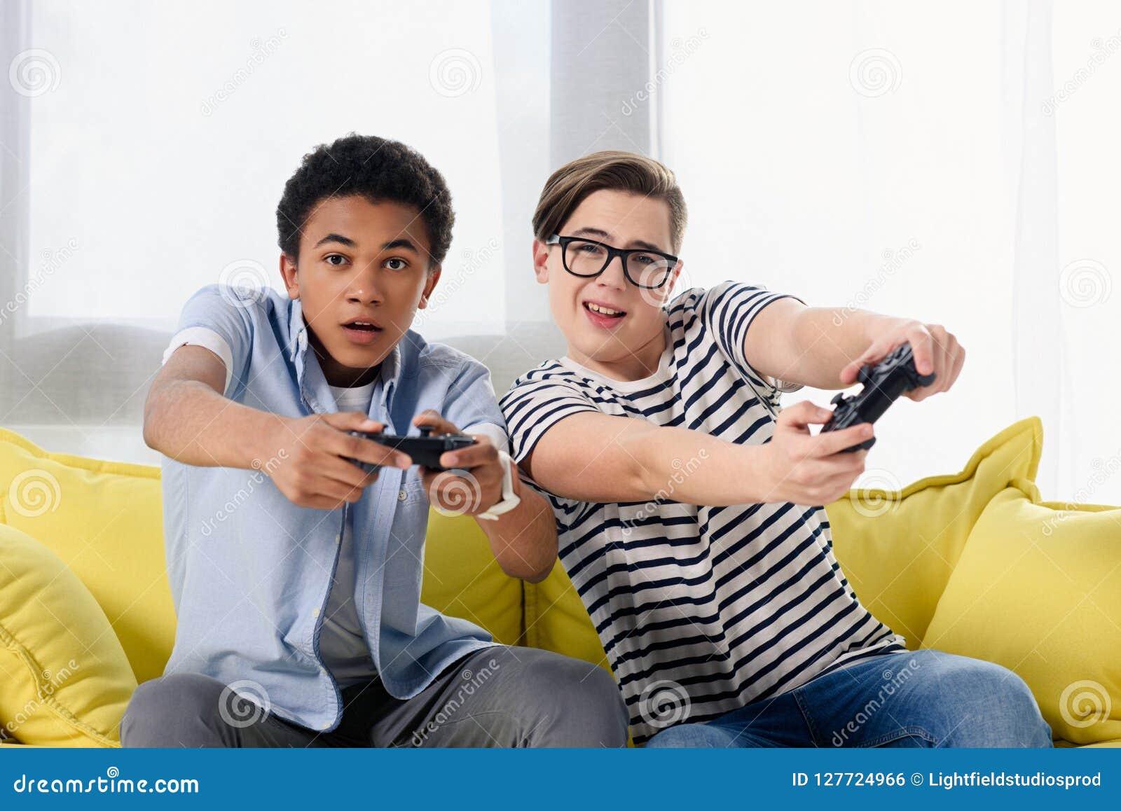 Multicultural Teen Boys Playing Video Game Stock Photo Image Of Sofa
