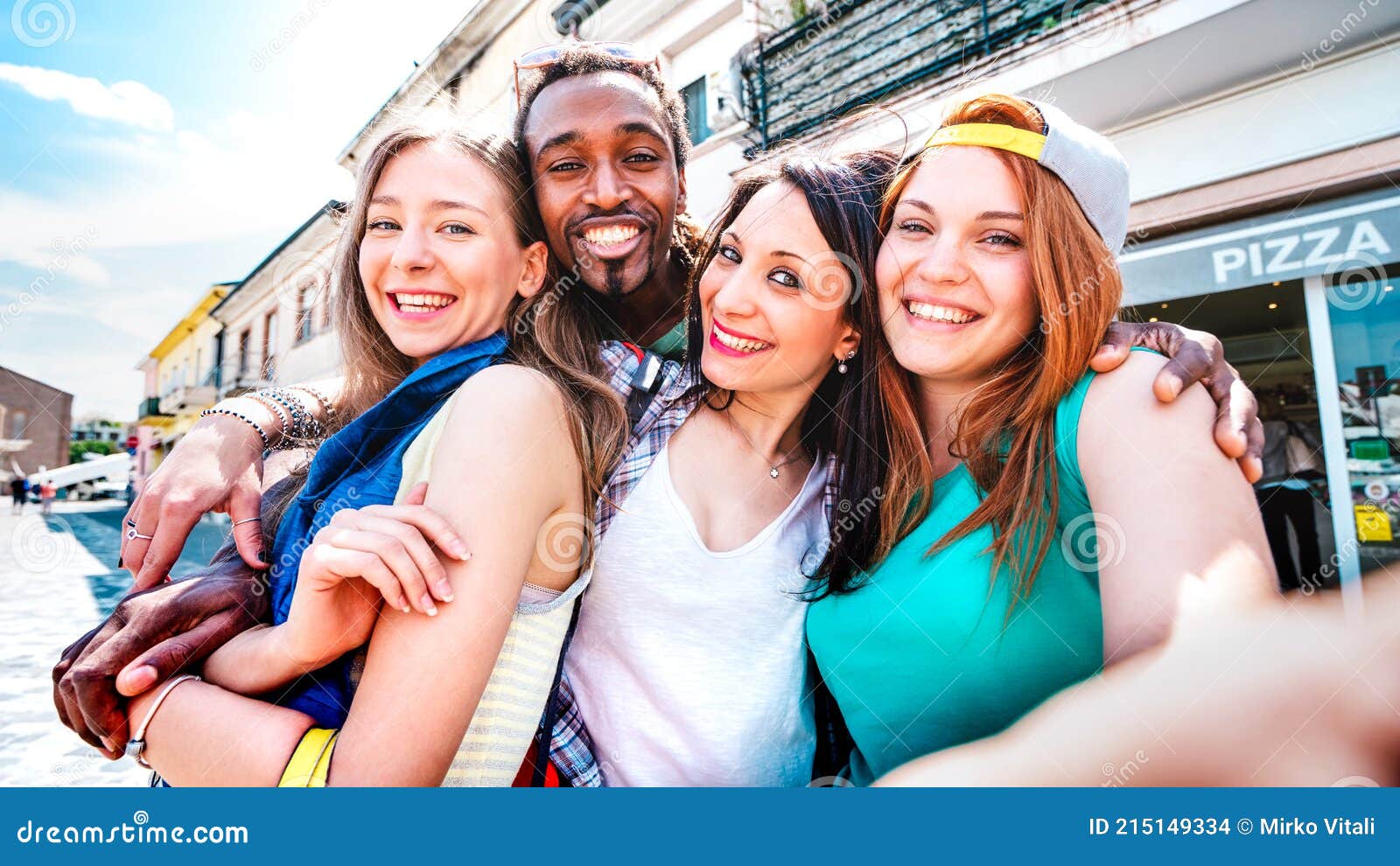 multicultural tourists group taking selfie at old town tour - happy millenial life style concept with young people having fun