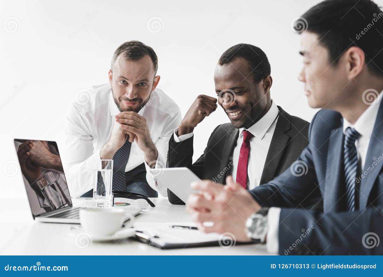 Multiethnic Businessmen Having Discussion during Meeting Stock Image ...