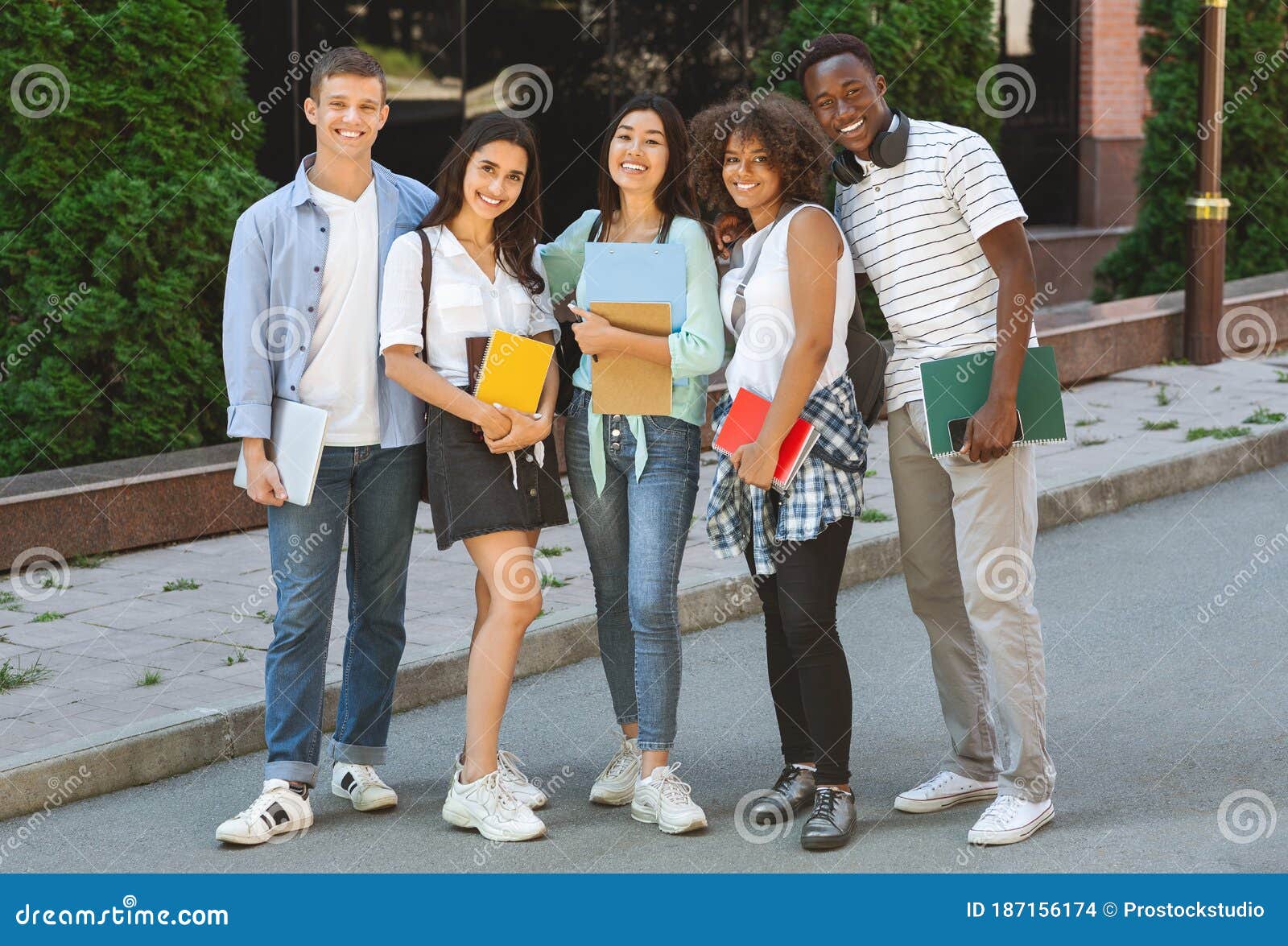 Multiethnic Group of Students Standing Outdoors in School Campus with