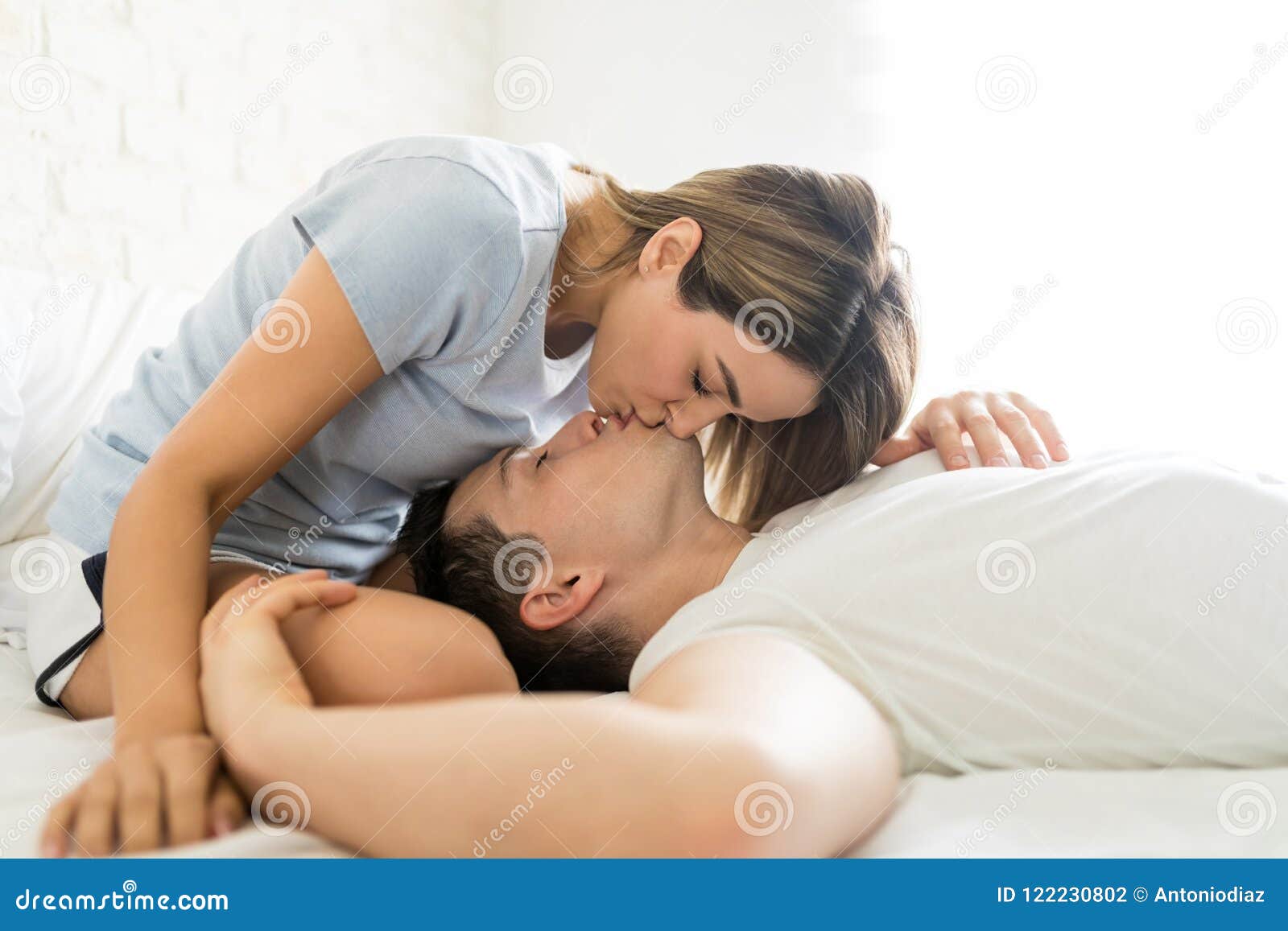 Couple Kissing On Lips In Bed During Cozy Morning Stock Photo Image Of Domestic Hispanic