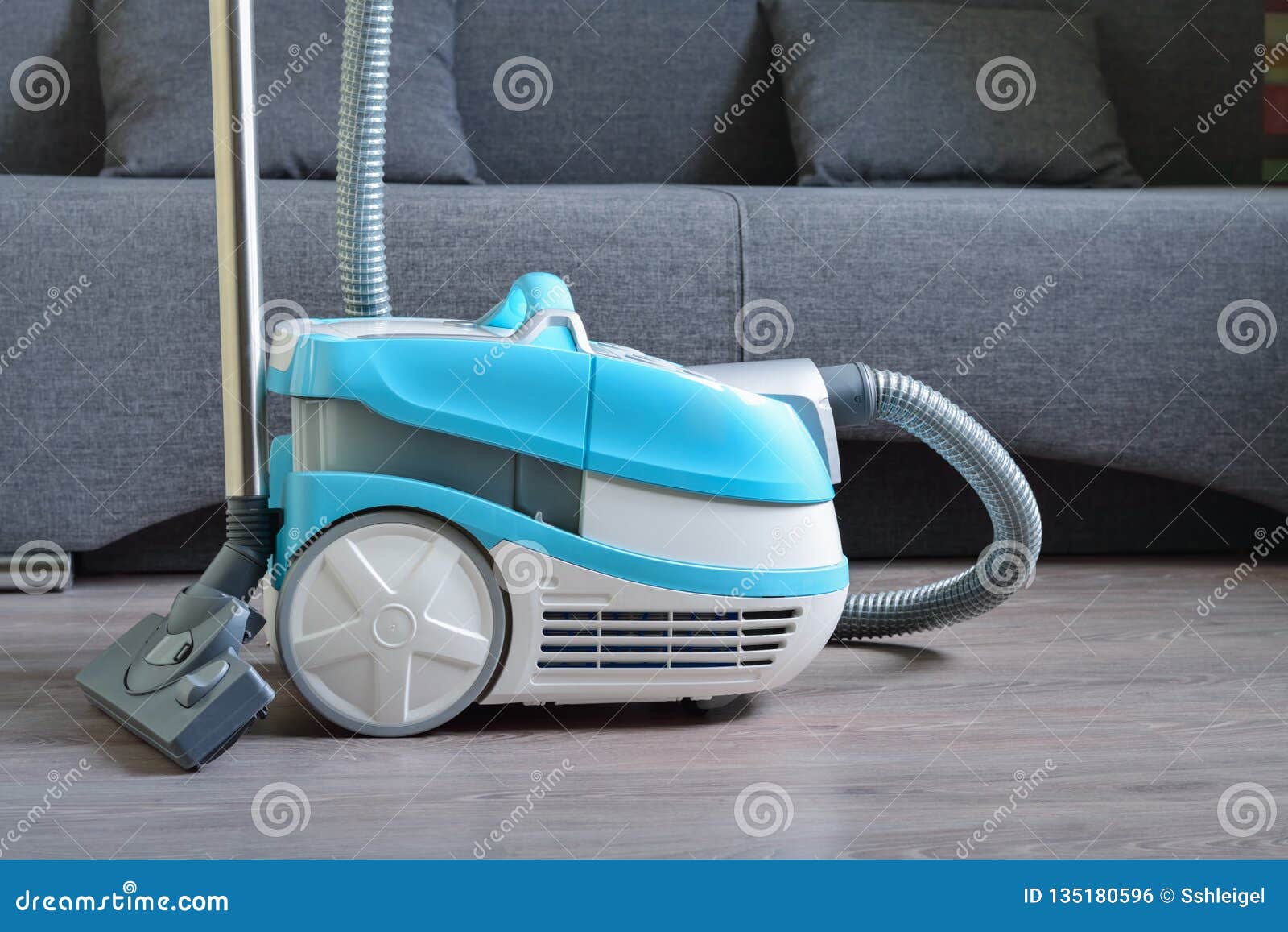 Multifunctional Vacuum Cleaner on the Laminate Floor Stock Photo