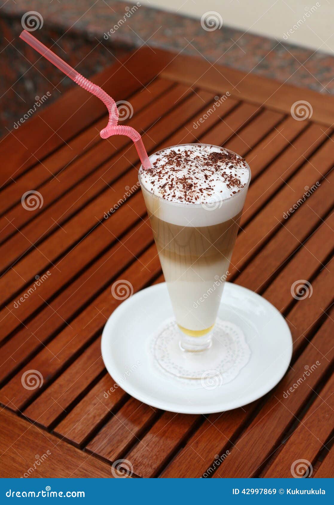 Multilayer Coffee with Chocolate Flakes on the Table Stock Image
