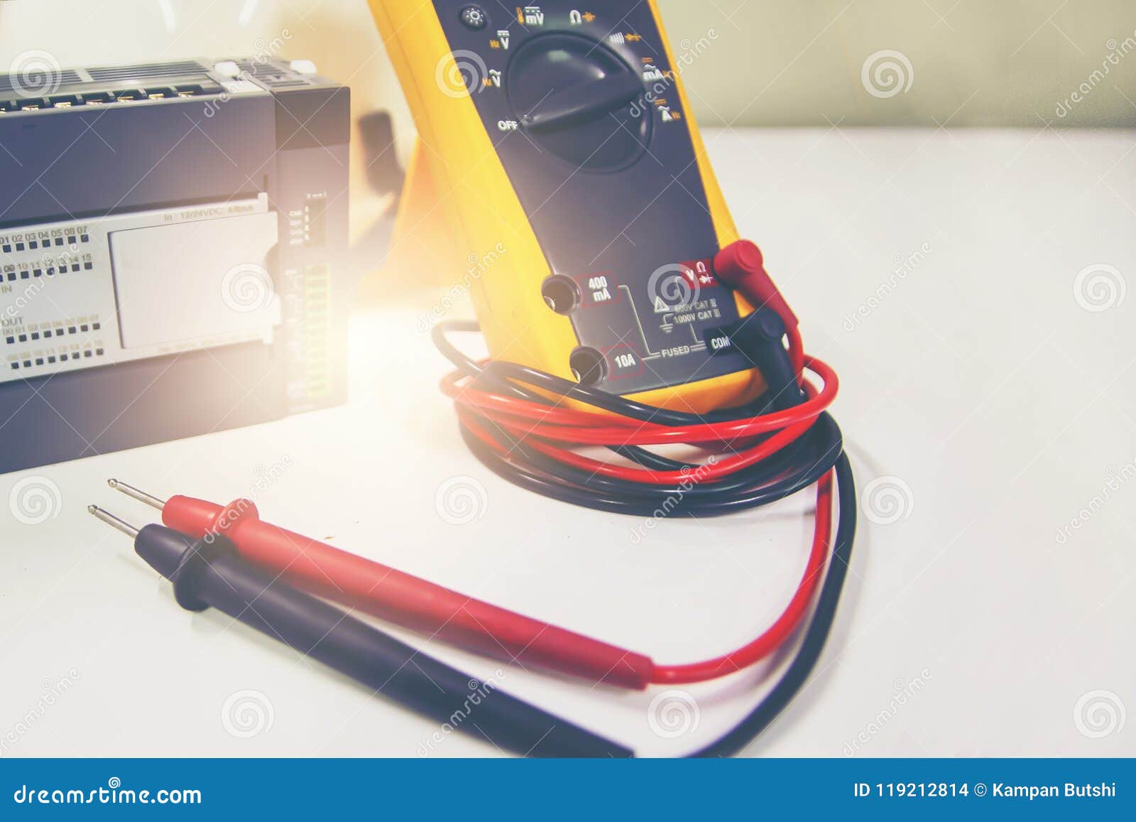 Multimeter with PLC Placed on White Table Stock Photo - Image of