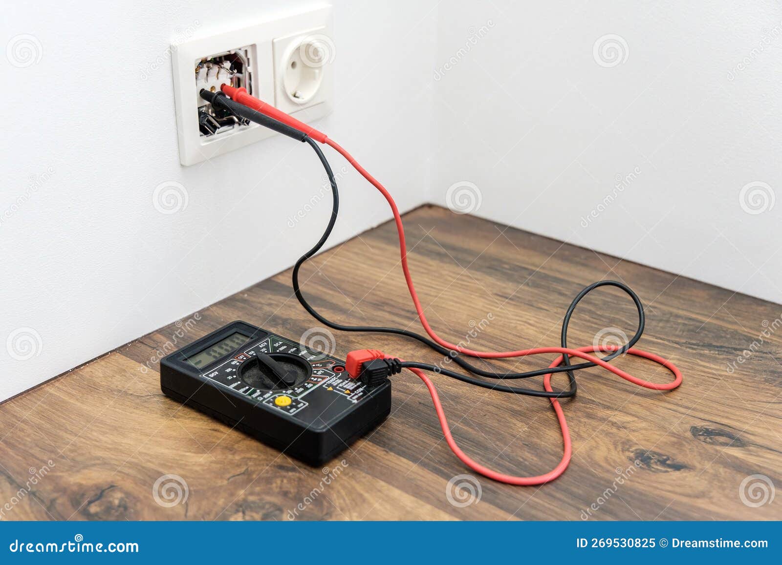 the multimeter is on the table. measuring voltage with a tester