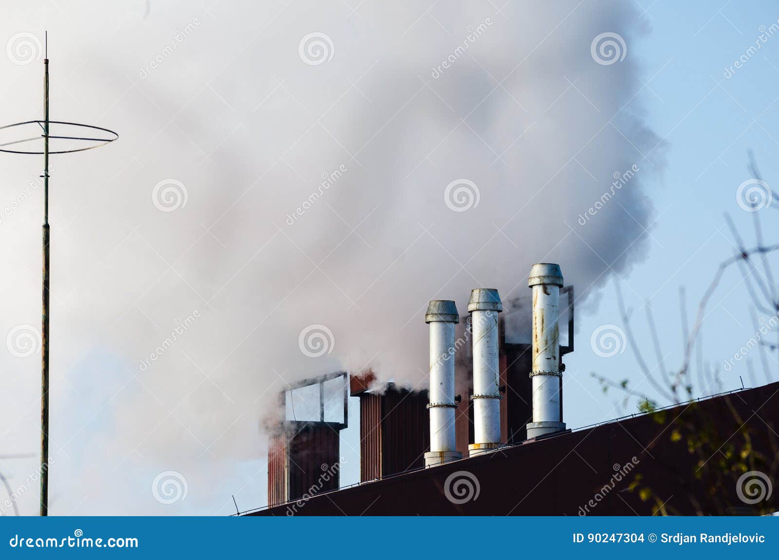 multiple coal fossil fuel power plant smokestacks emit carbon dioxide pollution.