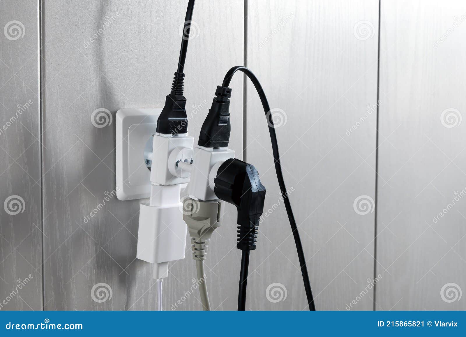 Multiple Plugs in Wall Electrical Outlet is Dangerous Overload, Closeup Stock Image Image of