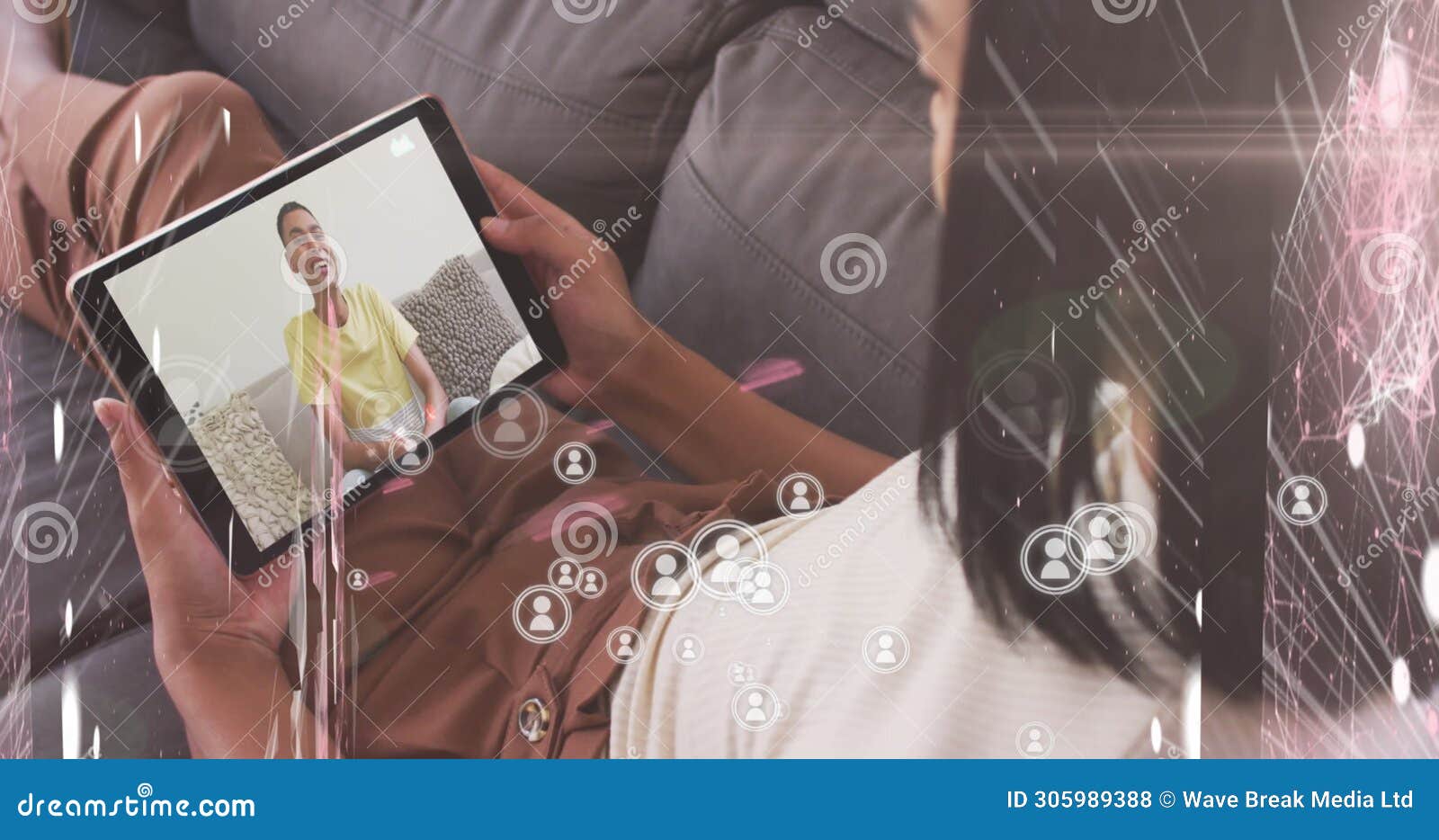 multiple profile icons floating against woman having a imagecall on digital tablet at home