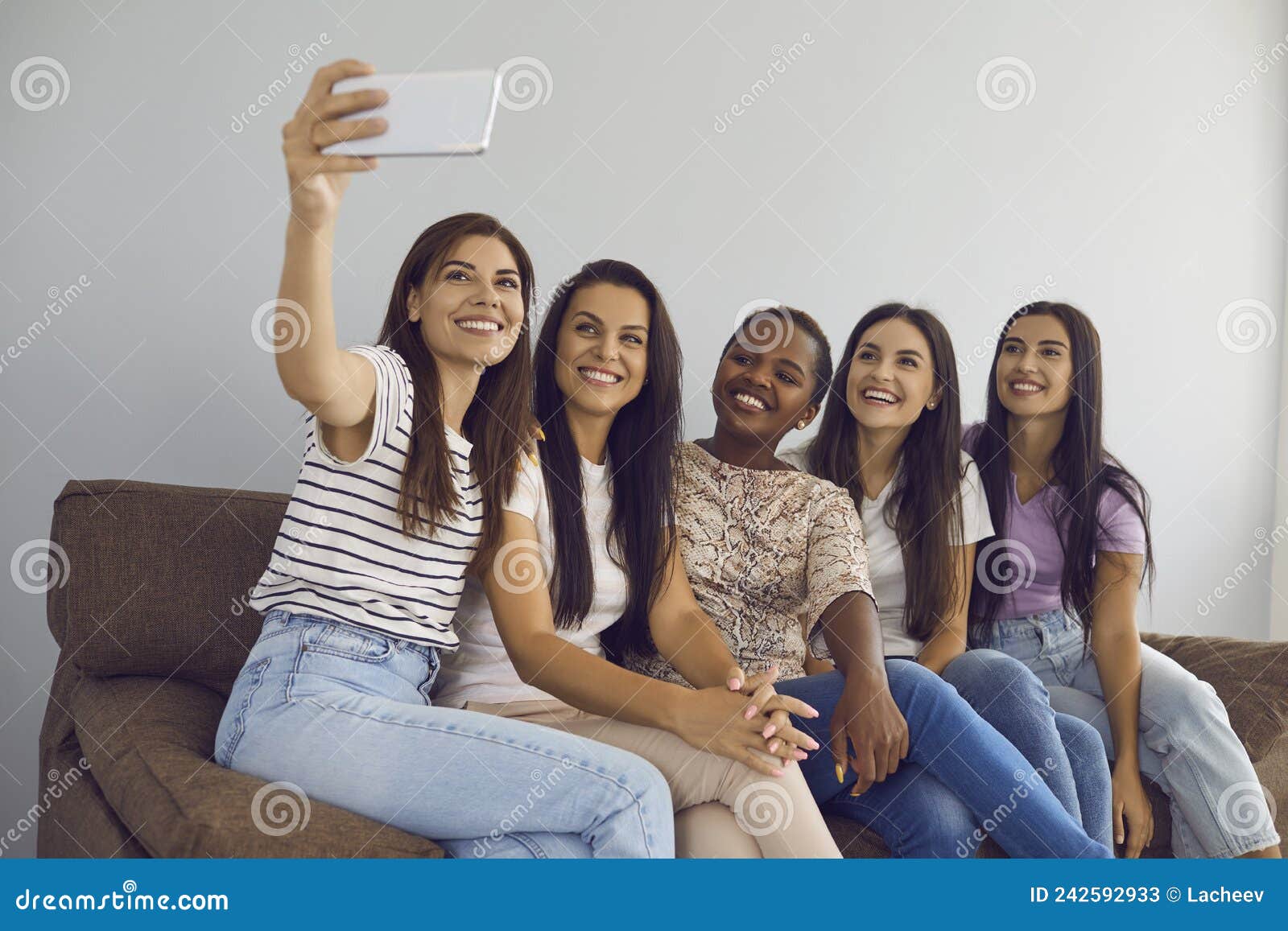 Multiracial Female Best Friends Take Selfies Together And Capture